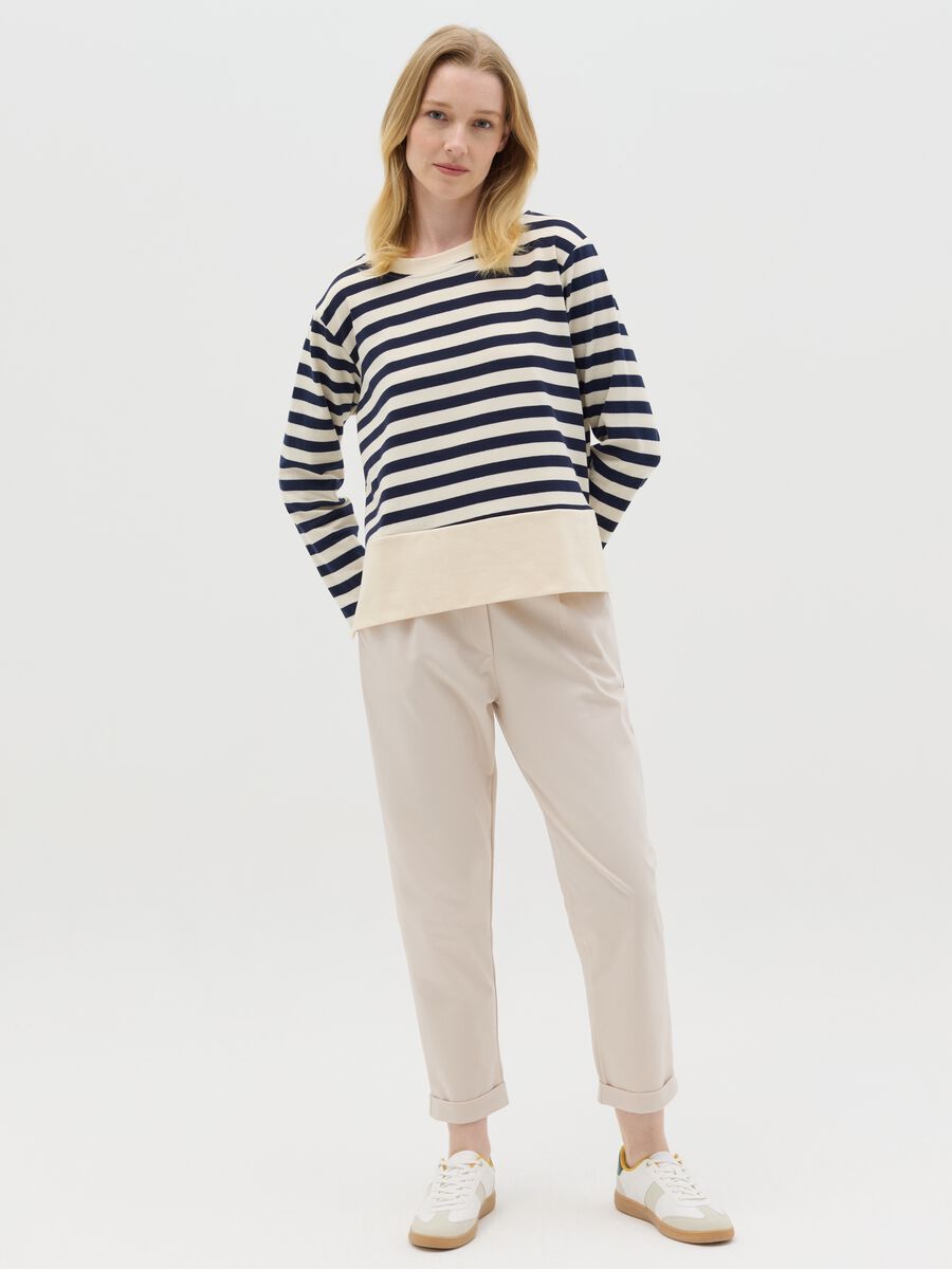 Beige cropped trousers with turn-ups_0