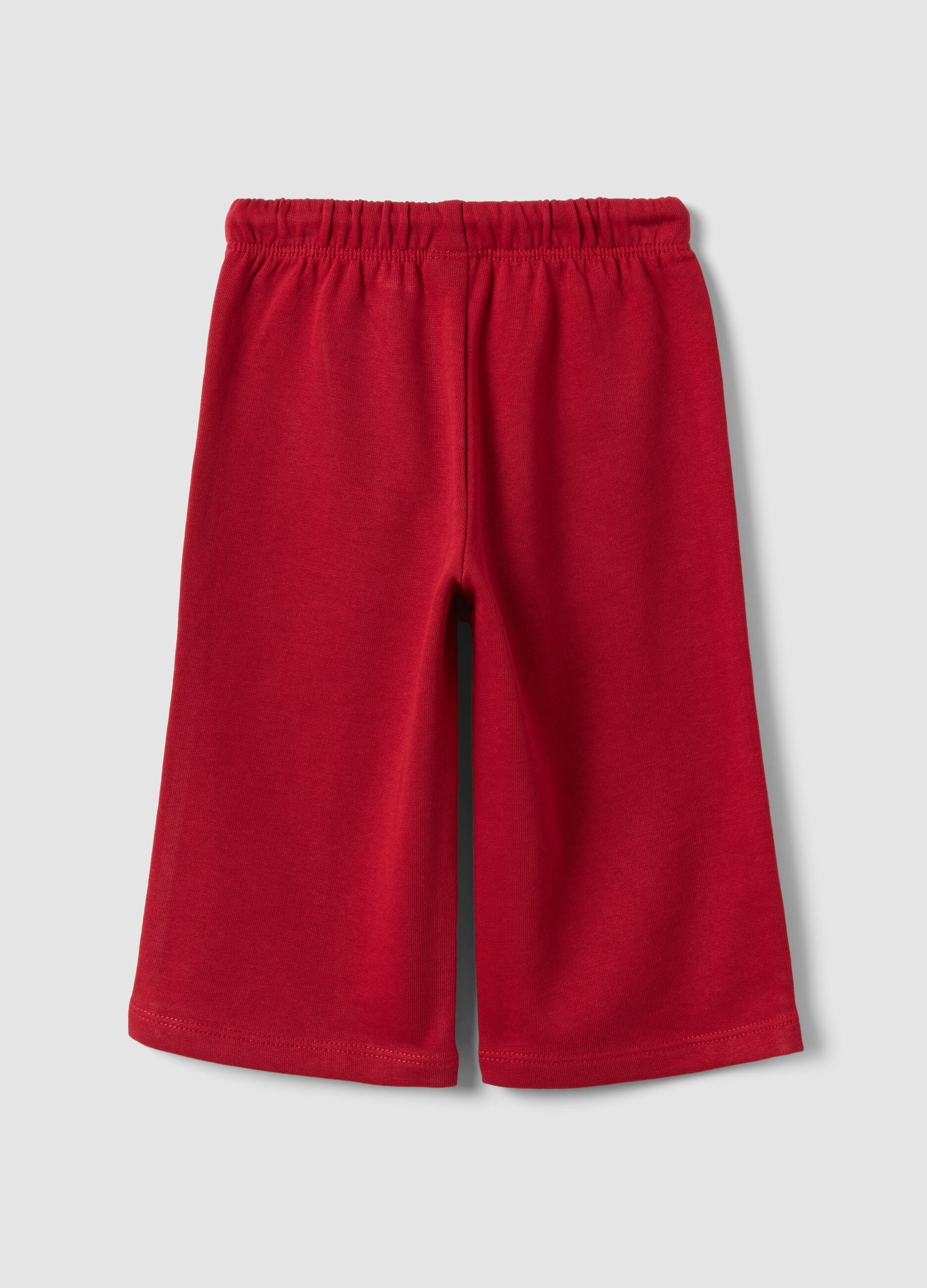 Red pure cotton trousers with elasticated waist and print for baby girls