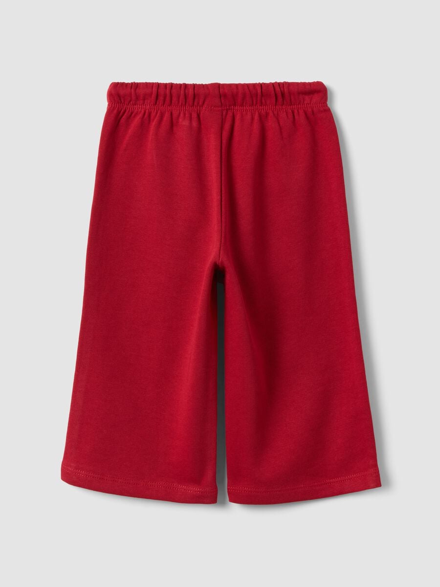 Red pure cotton trousers with elasticated waist and print for baby girls_1
