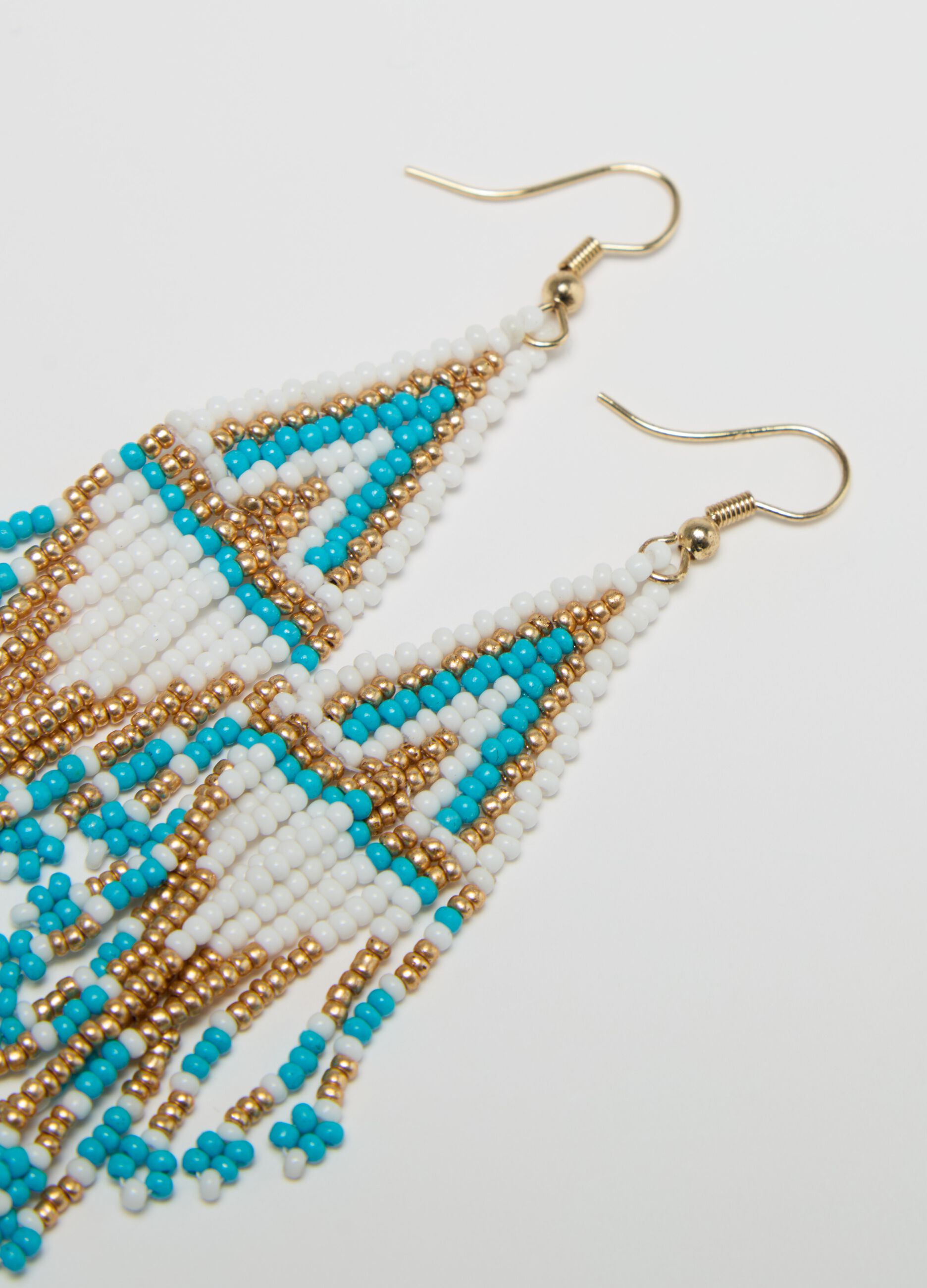 Pendant earrings with ethnic motif