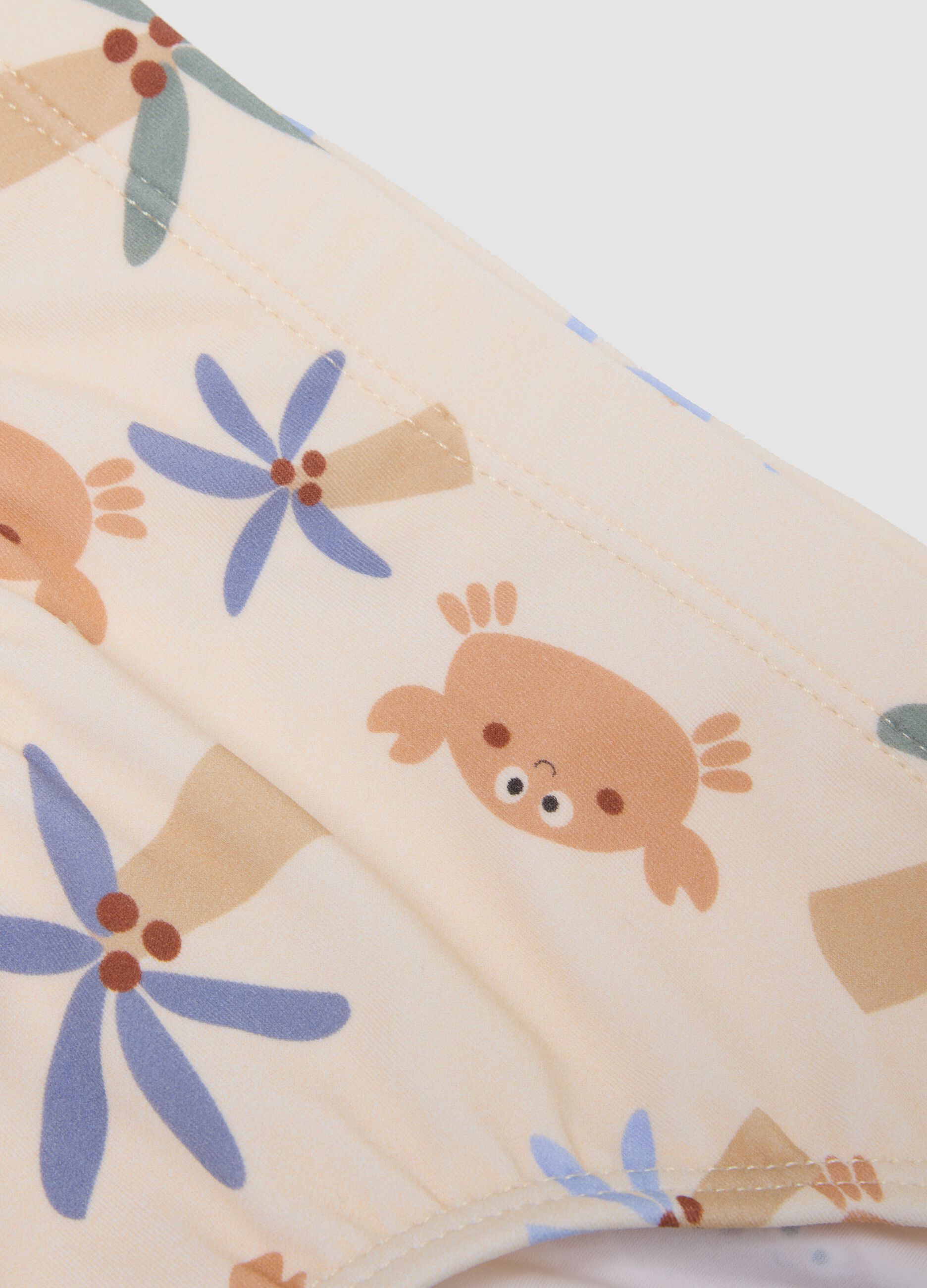Beige baby swim briefs with prints