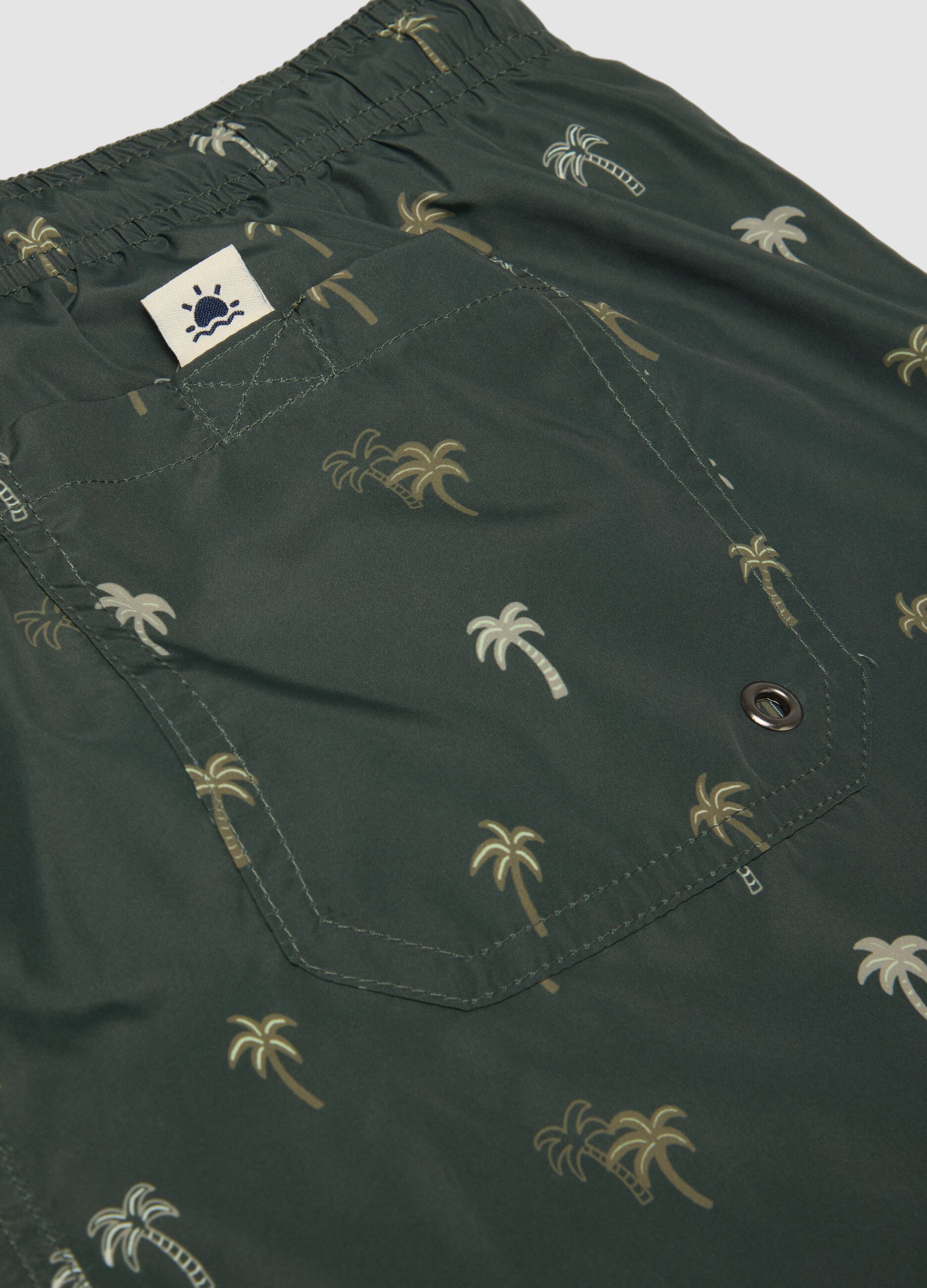 Costume boxer verde con stampa palme