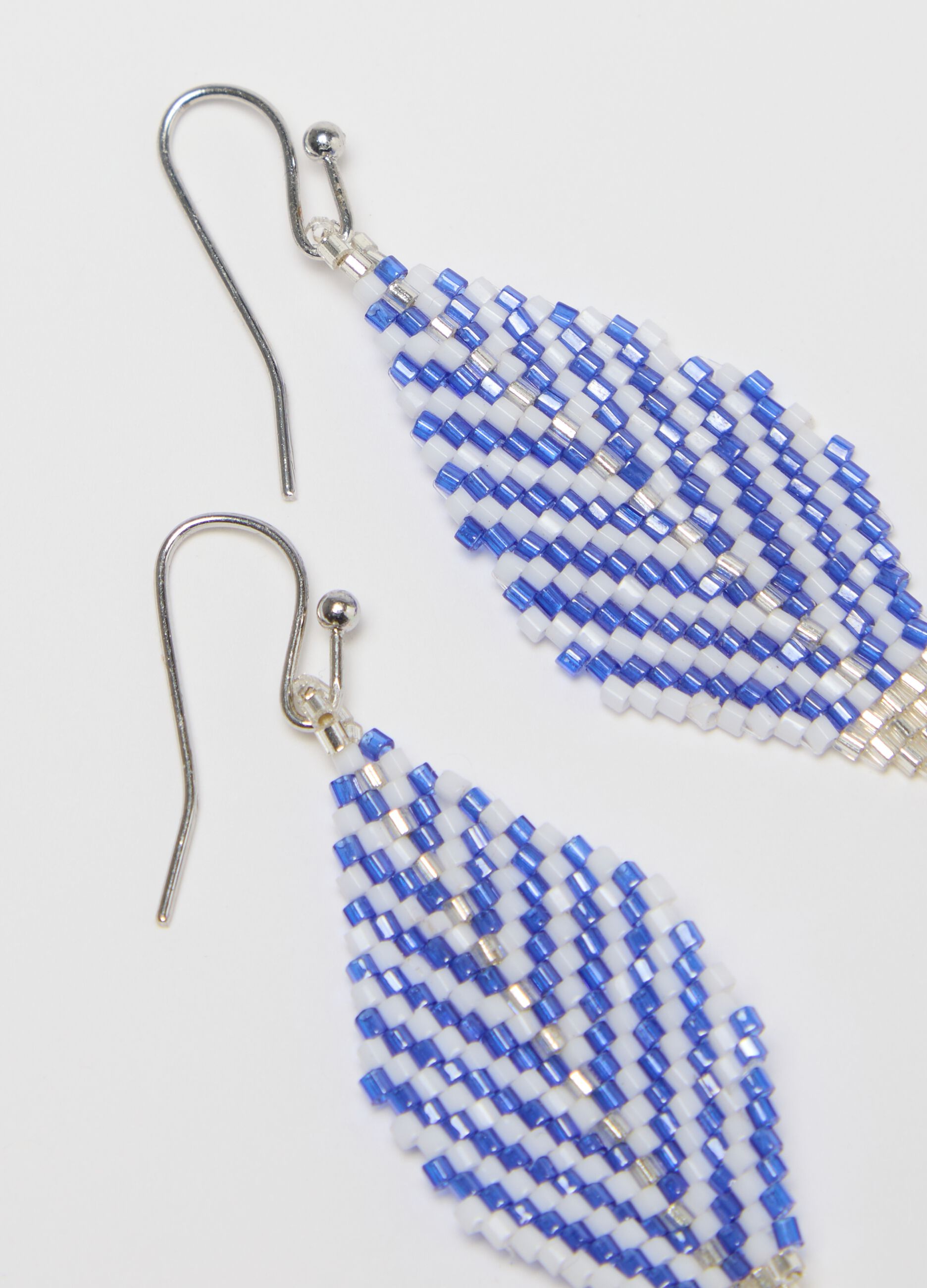 White and blue diamond-shaped pendant earrings
