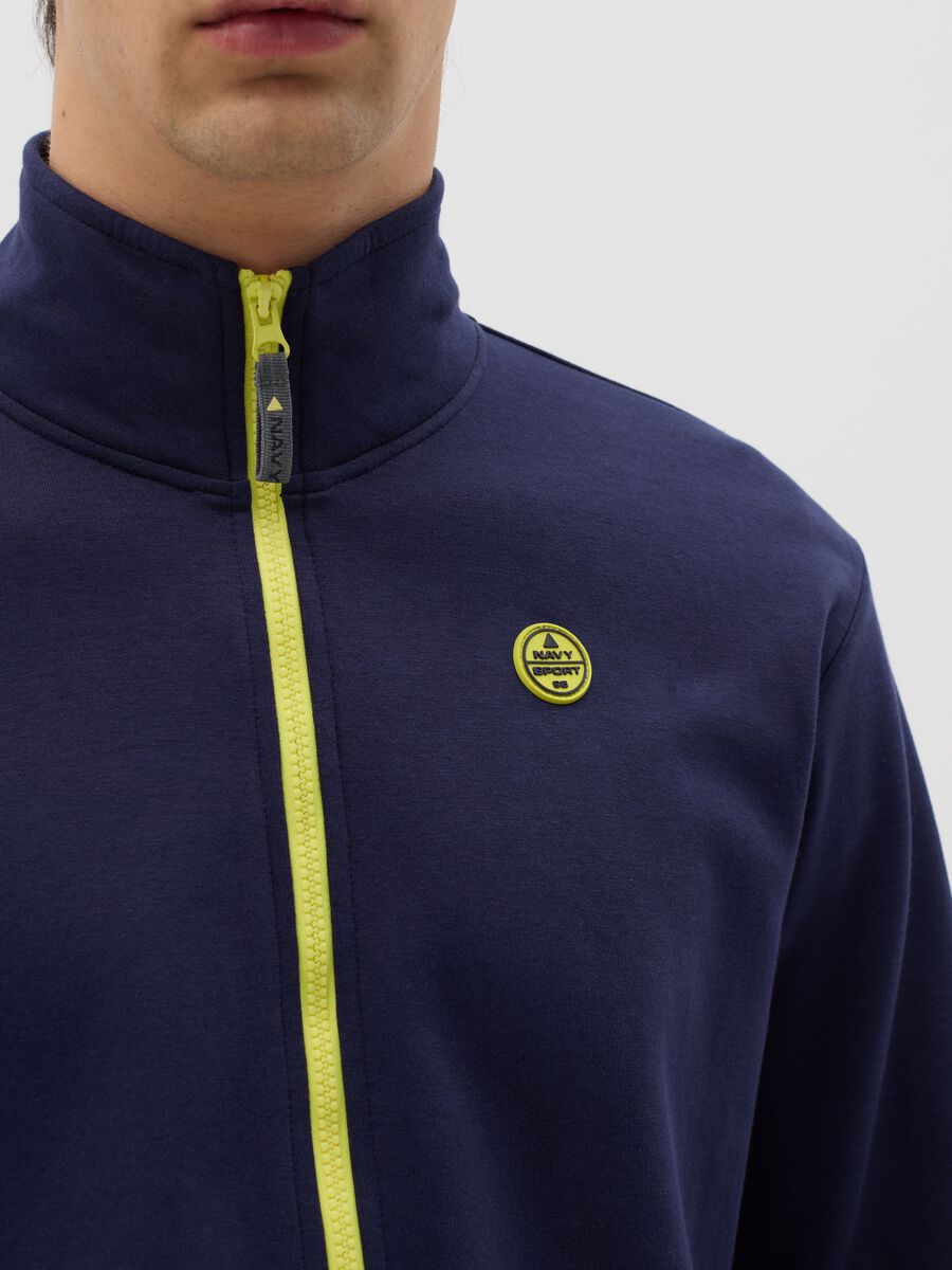 Blue full-zip sweatshirt with yellow details and logo_2