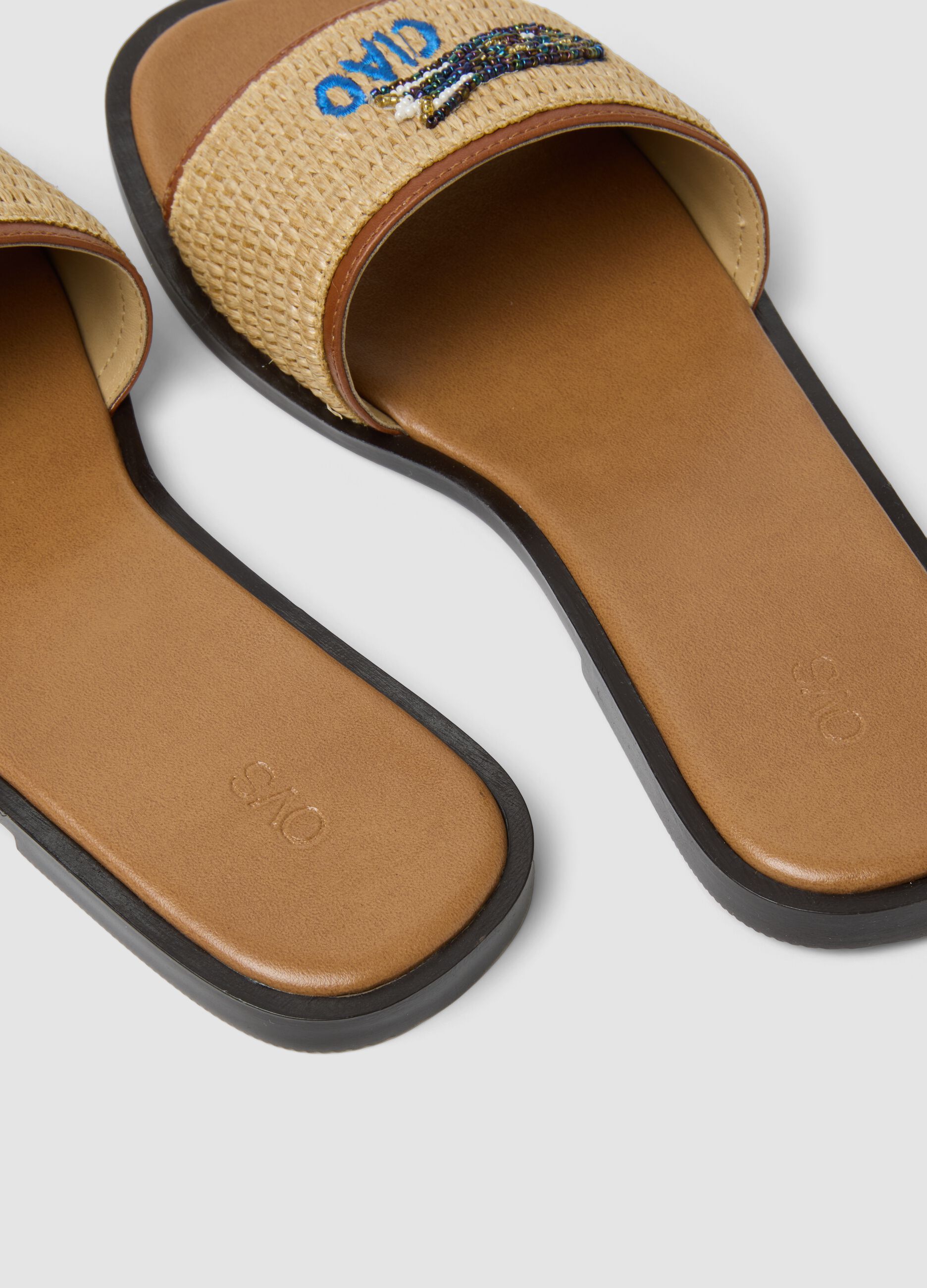 Beige flat sandals with braided embroidered strap