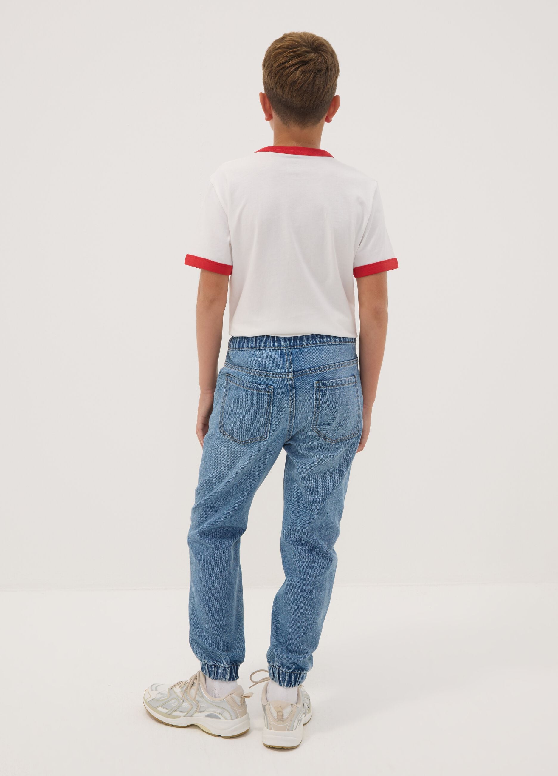 Blue denim jogger jeans in a cotton and viscose blend for boys