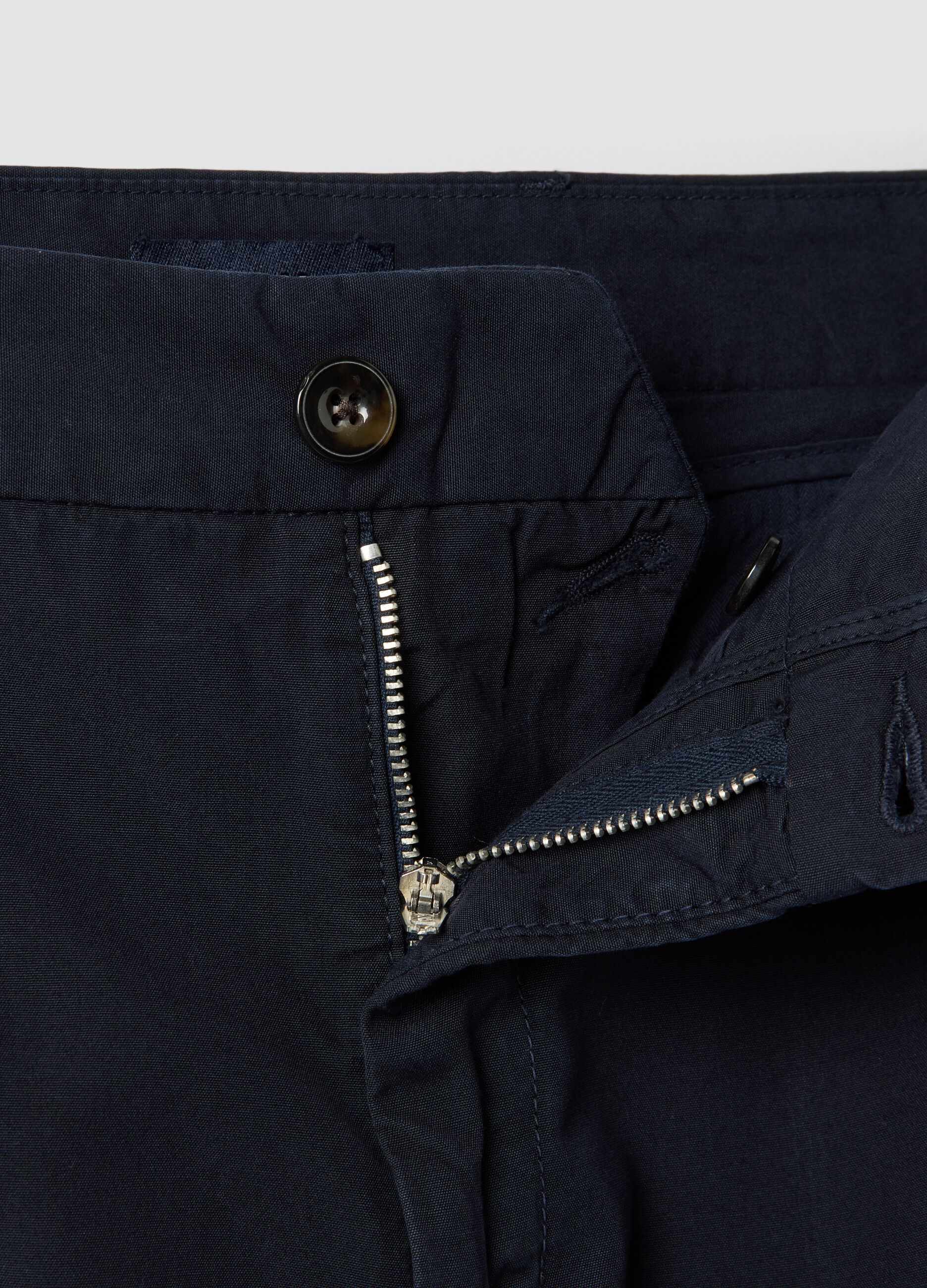 Blue cotton chino trousers with carrot fit
