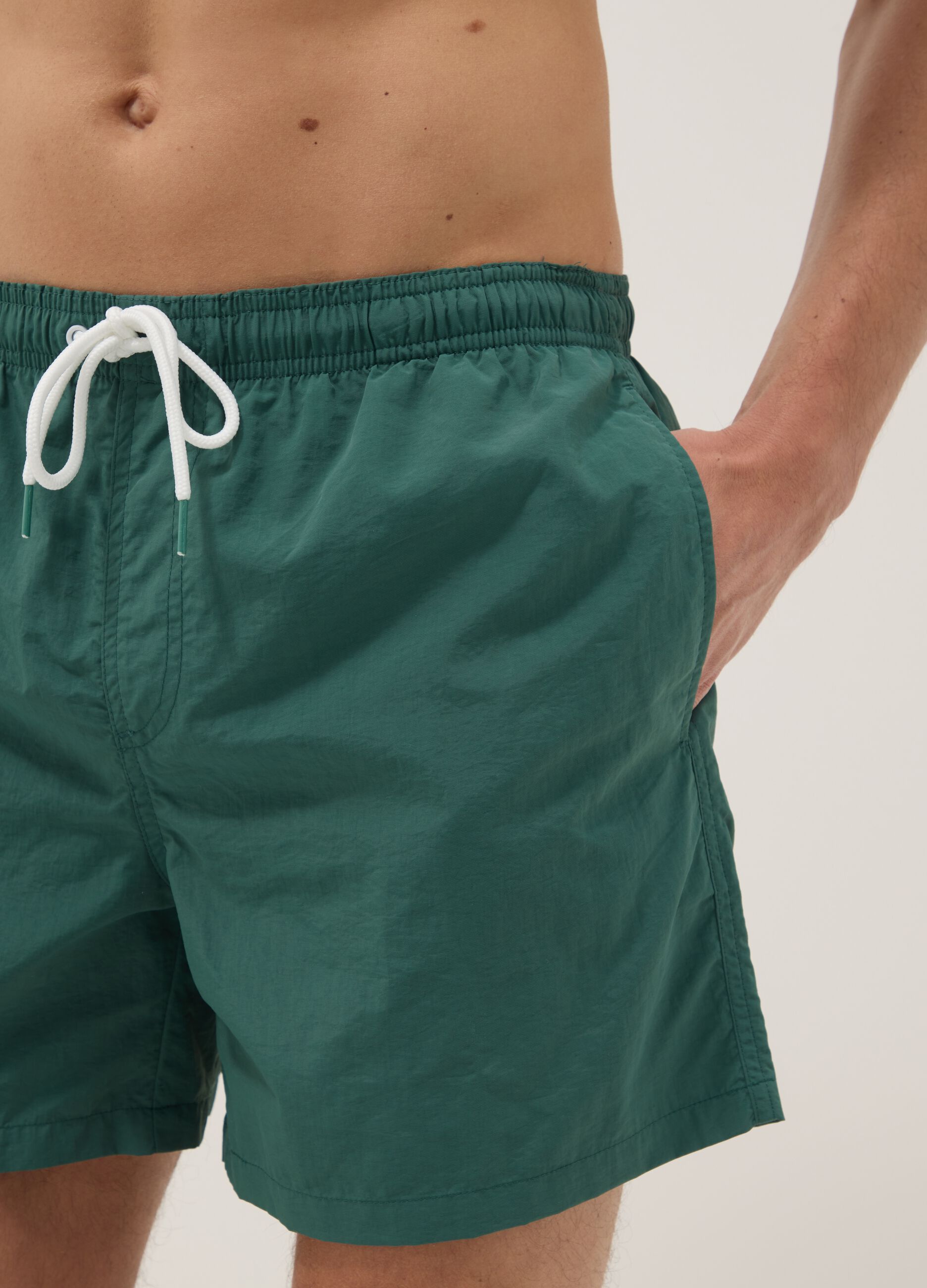 Green swim shorts with elasticated waist