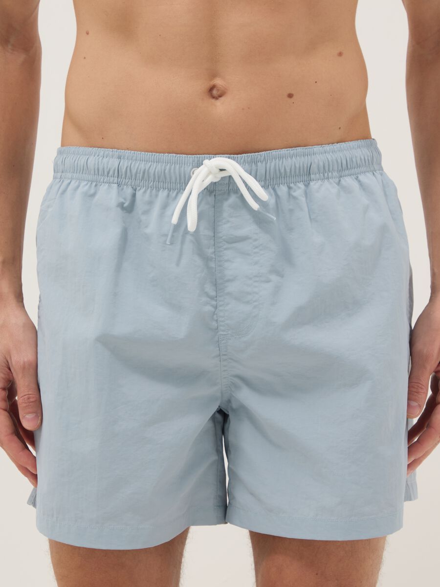 Blue swim shorts with elasticated waistband_1