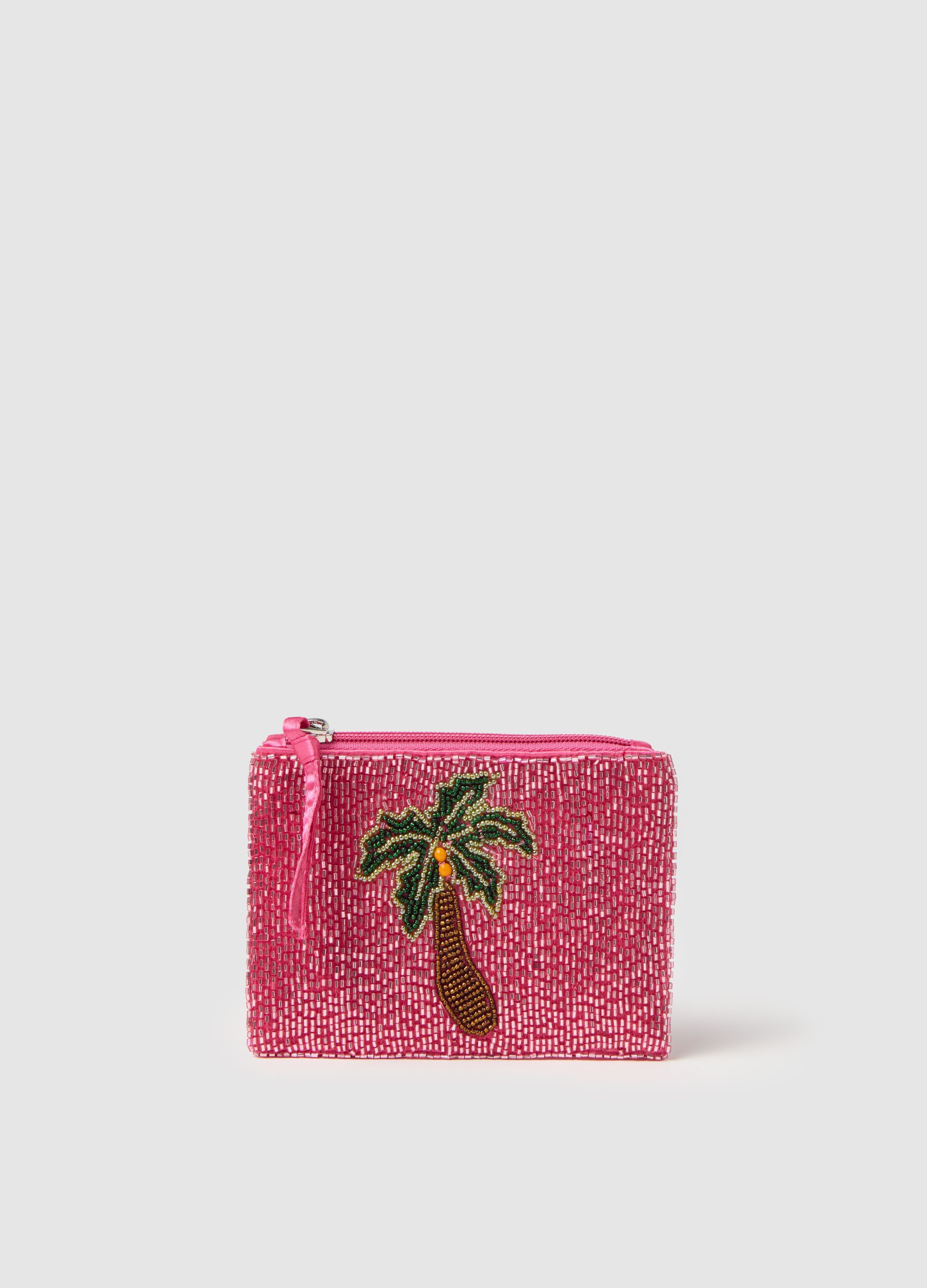 Pink wallet with glass and palm decoration