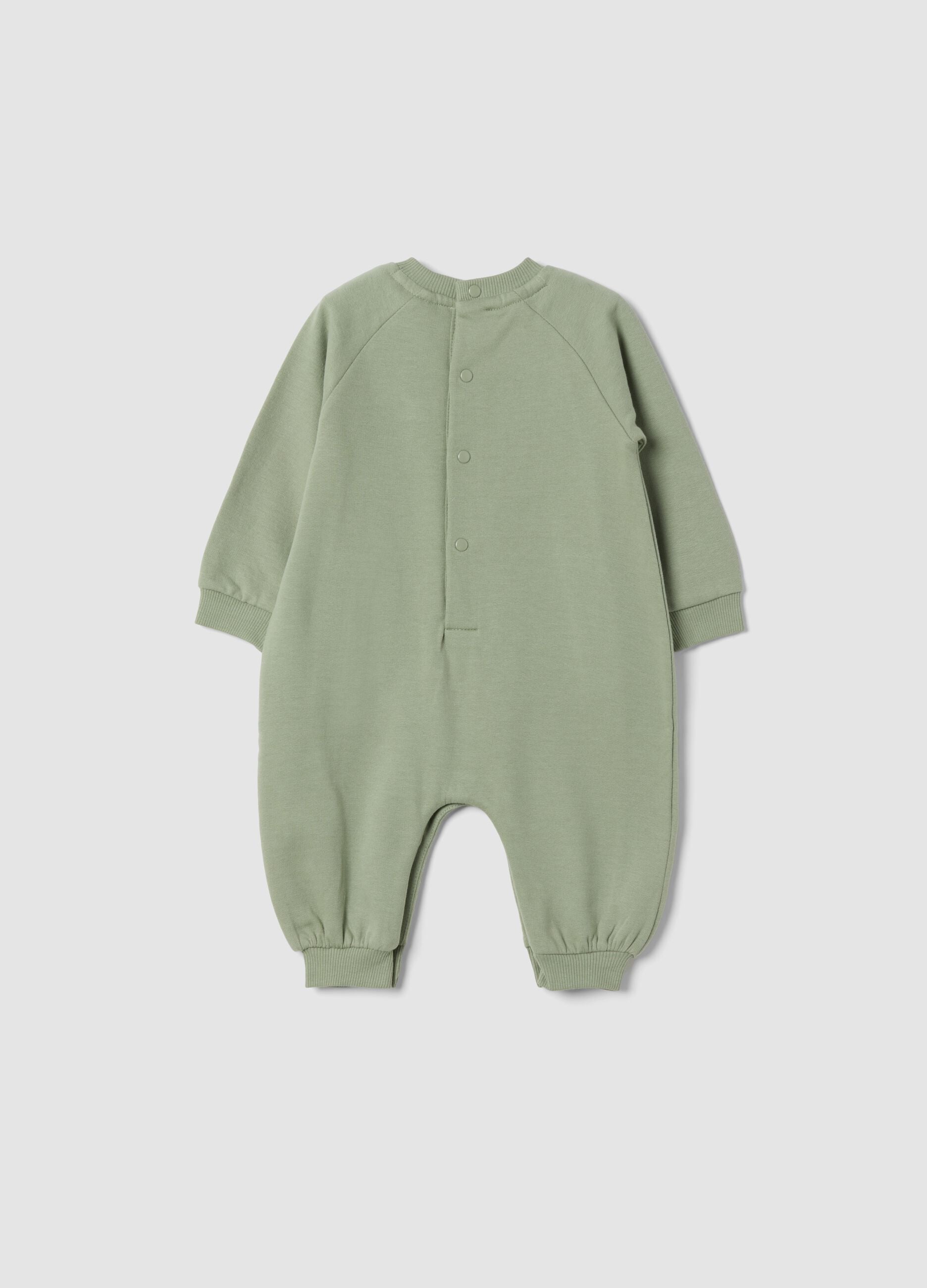 Green organic cotton sleepsuit with Toy Story print