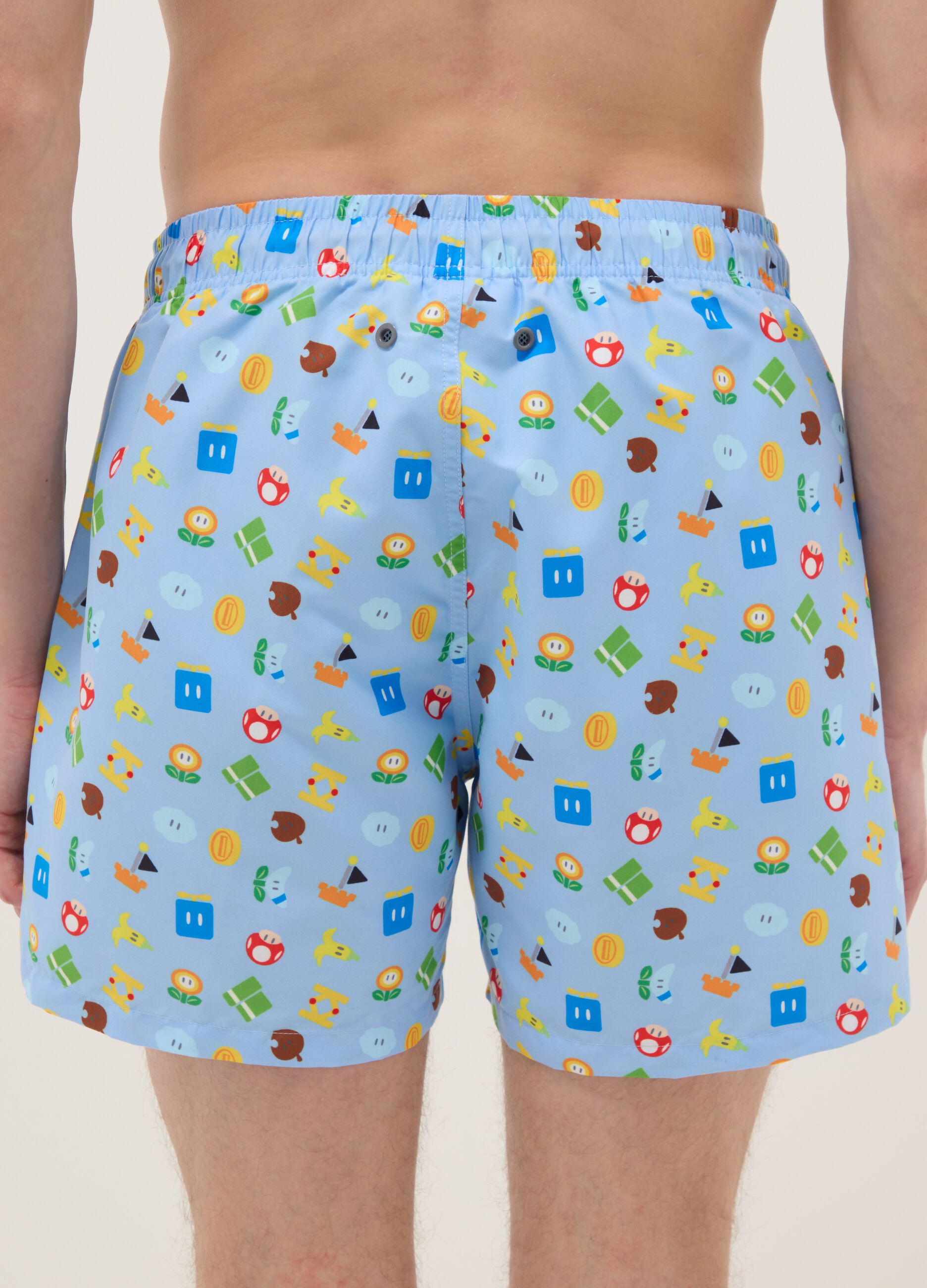 Blue swim shorts with Super Mario prints