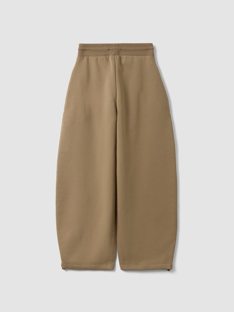 Beige cotton-blend baggy-fit jogger trousers_1