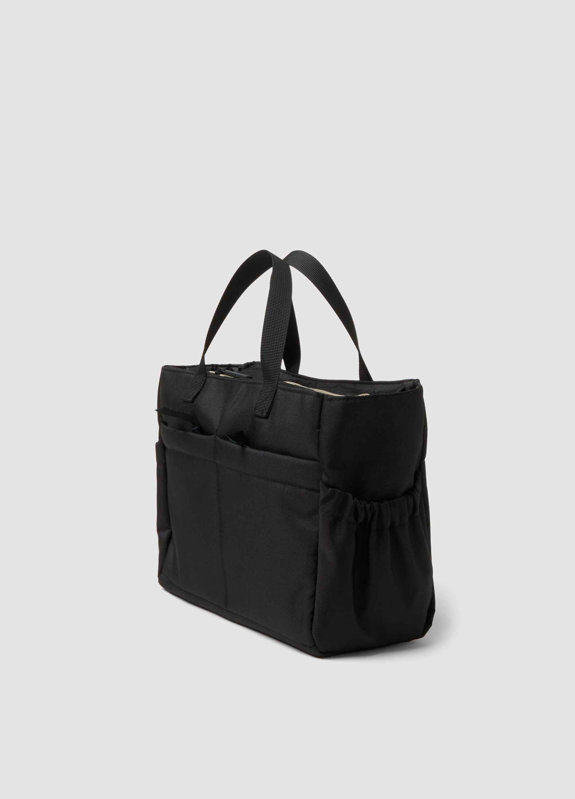 Black handbag with external pockets and double handles