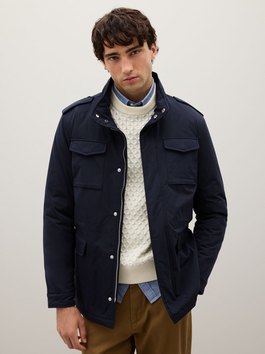 Regular fit blue jacket with pockets and zip closure_0