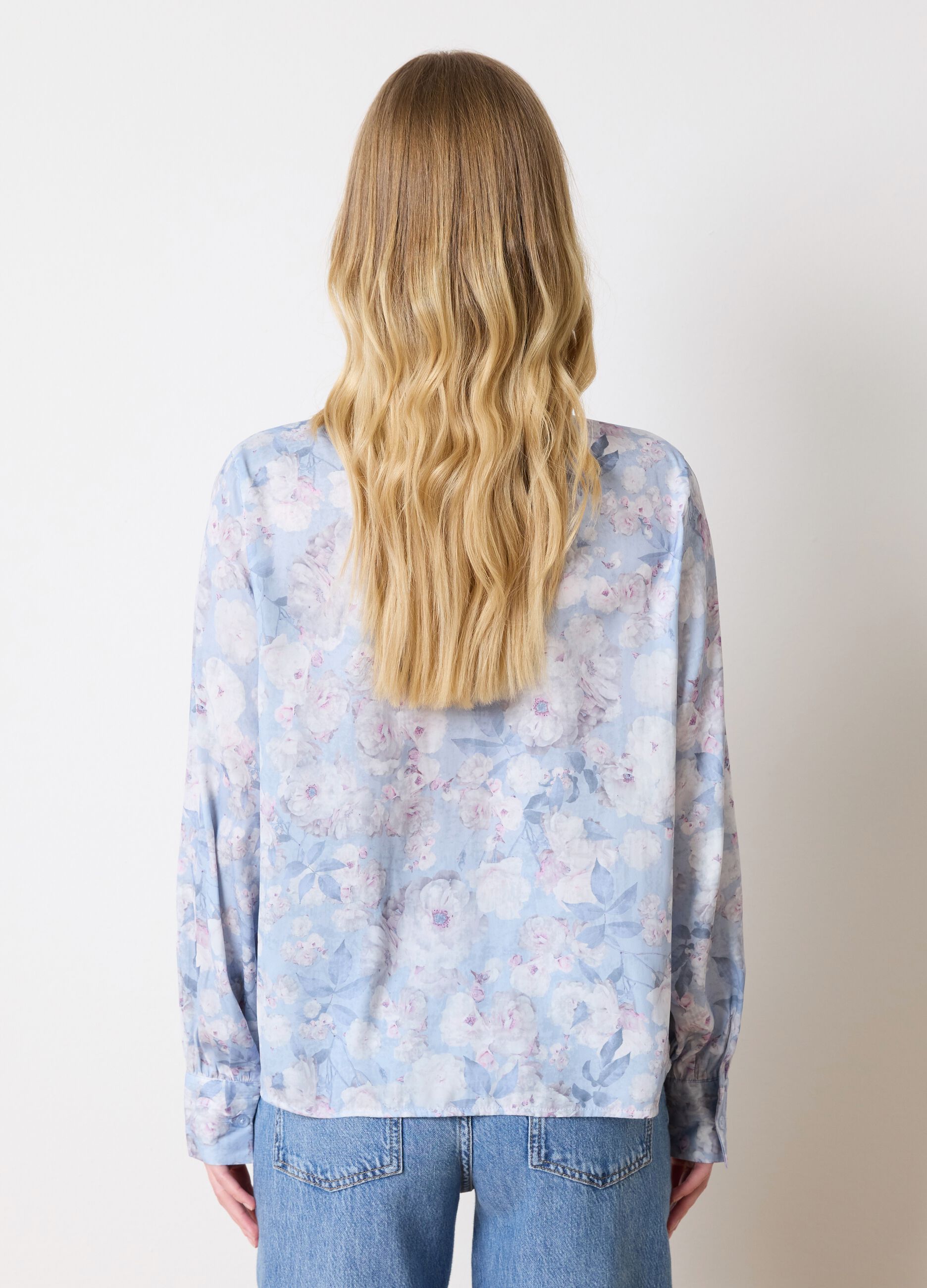 Light blue blouse with floral pattern and bow