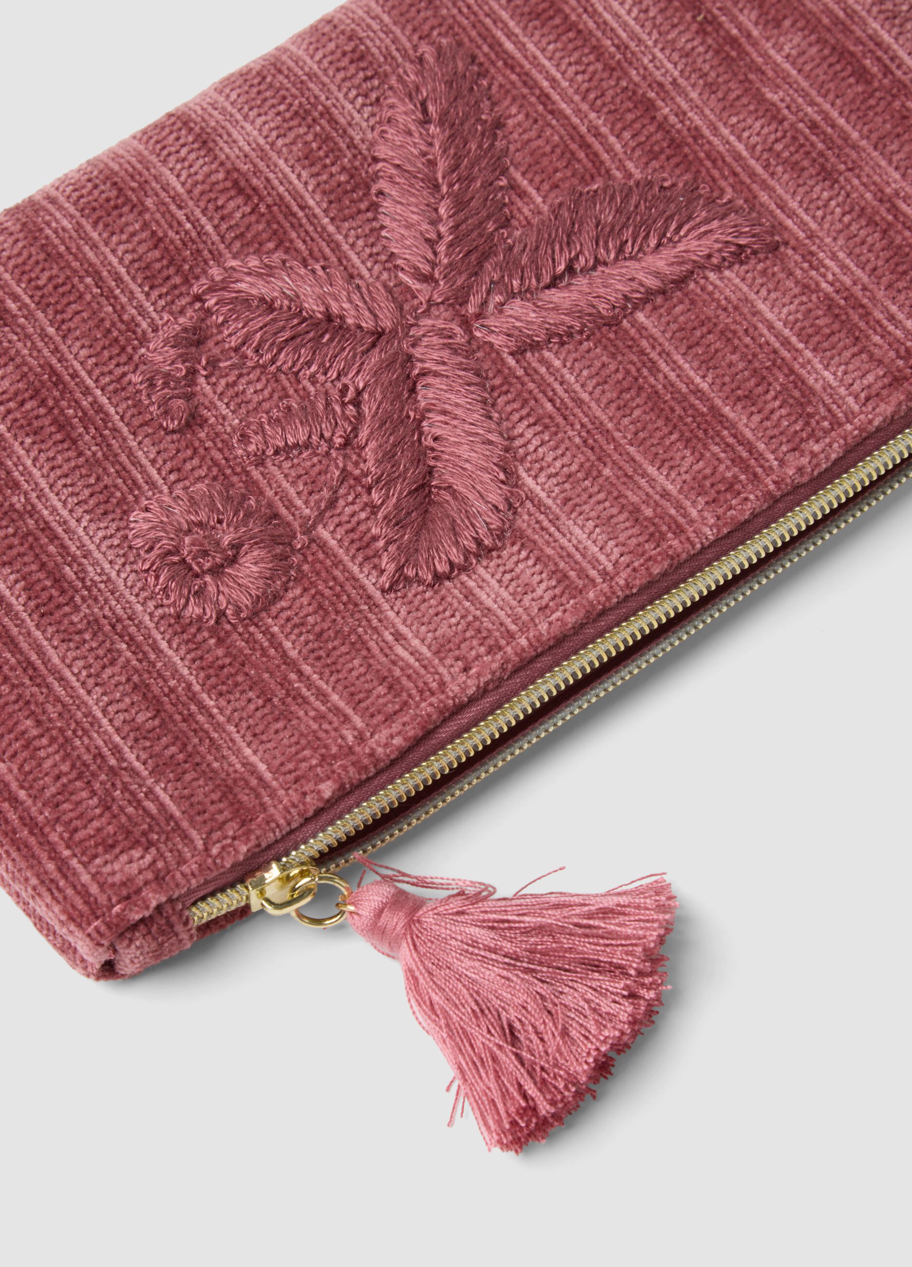Pink clutch bag with floral embroidery and tassel