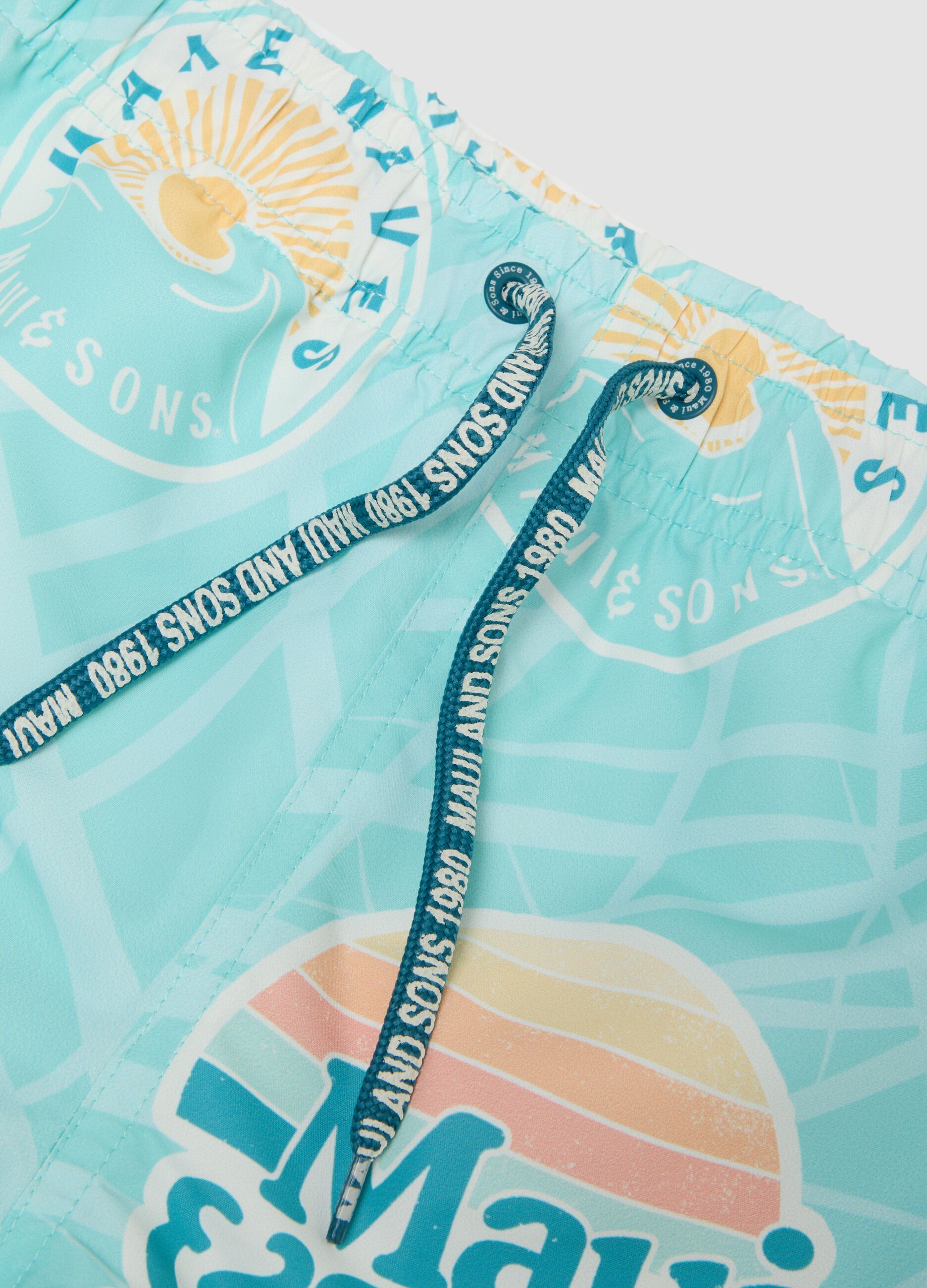 Blue boys&rsquo; swim shorts with all-over print