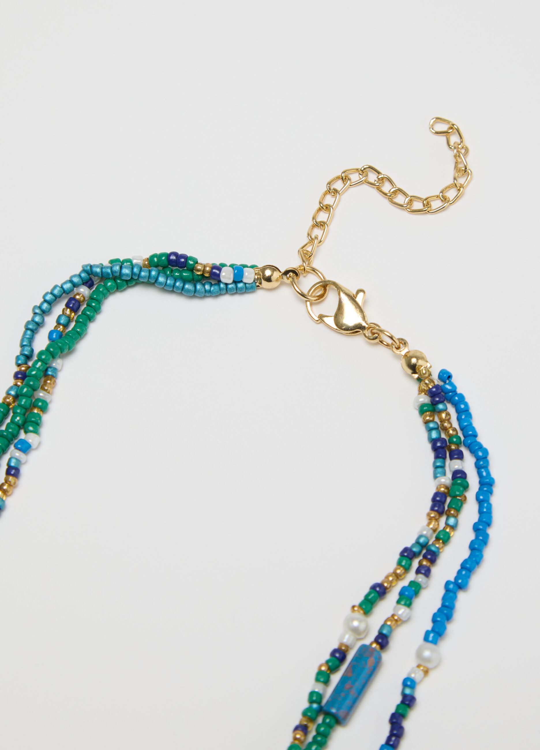 Multi-strand necklace with beads and shell
