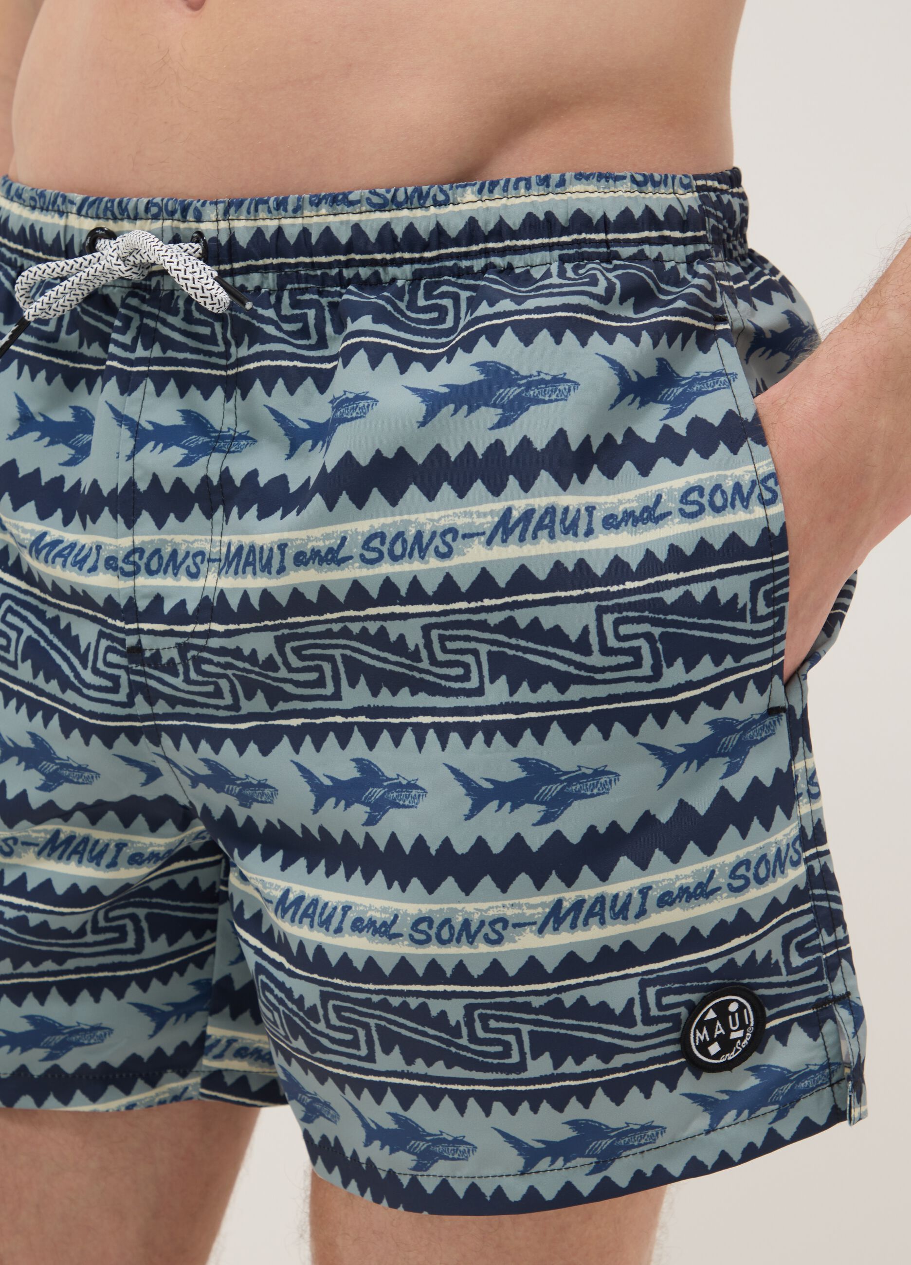 Multicolour swim shorts with sharks and geometric patterns