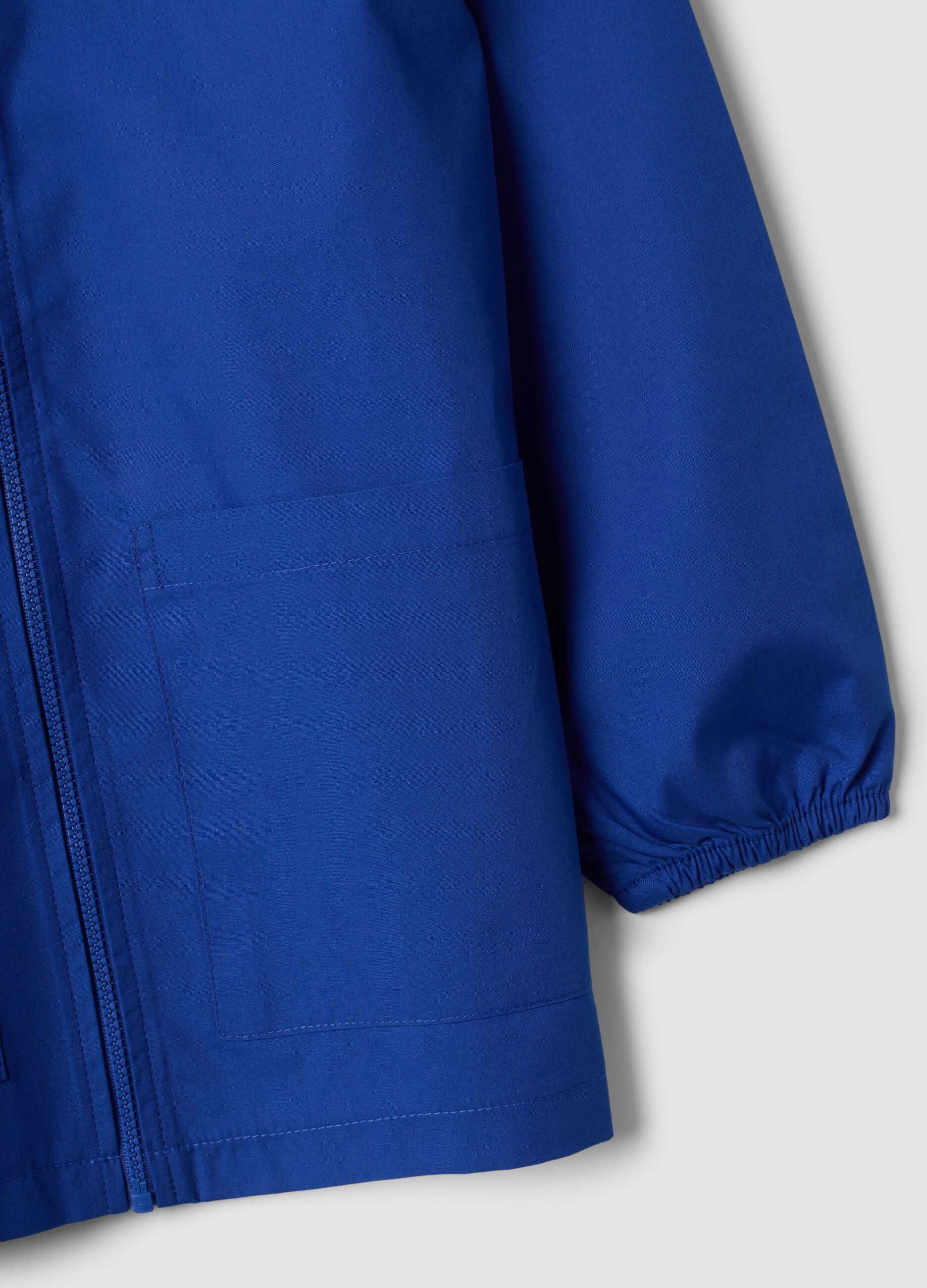 Blue boys&rsquo; school apron with zip and go-kart embroidery