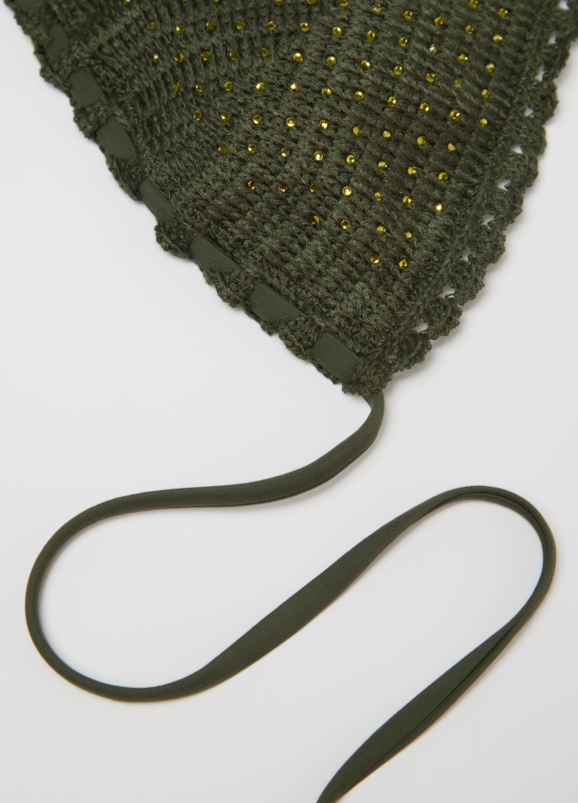 Women’s green bikini top with perforated design details