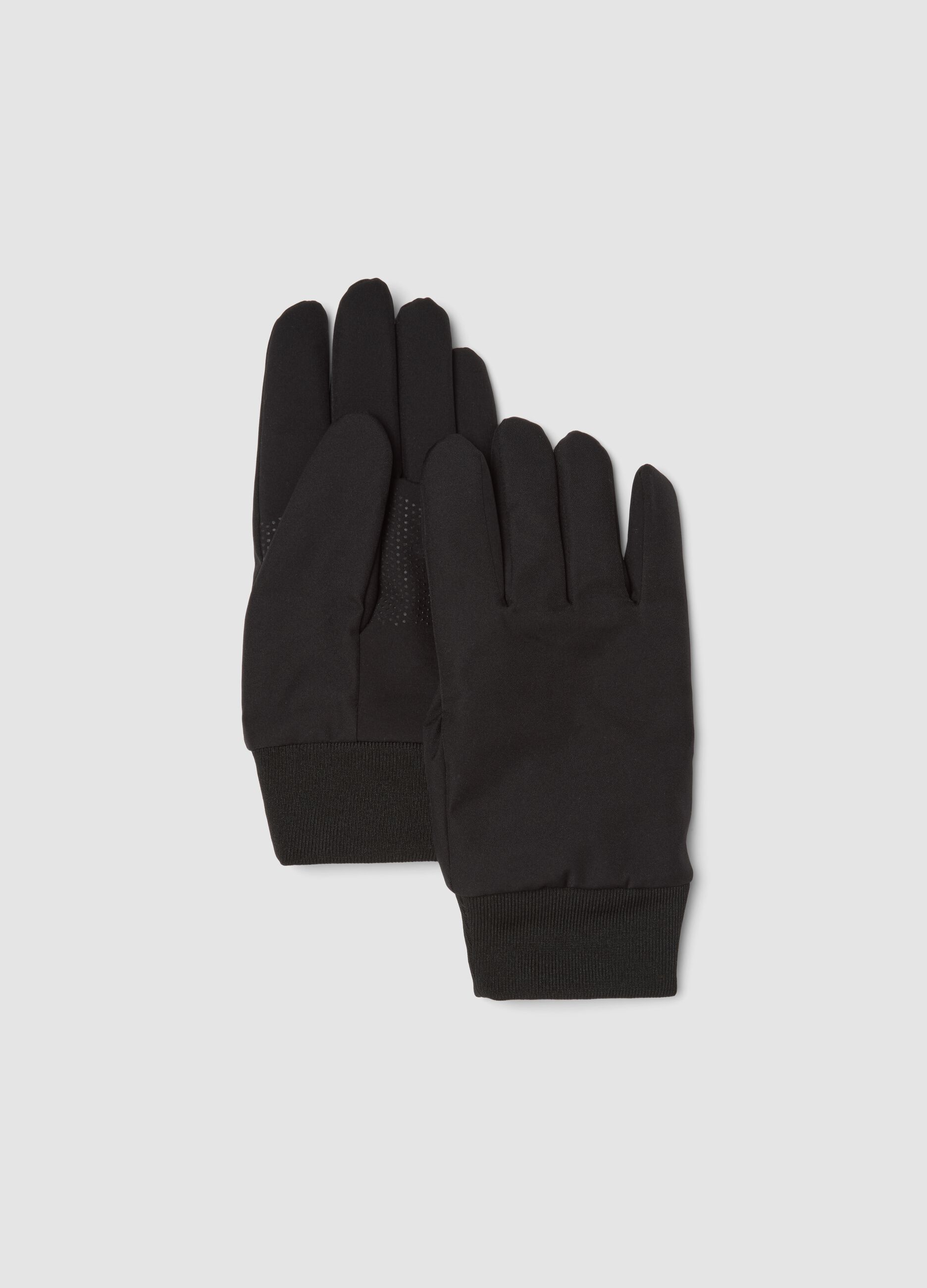 Black gloves with ribbed cuffs and non-slip grips