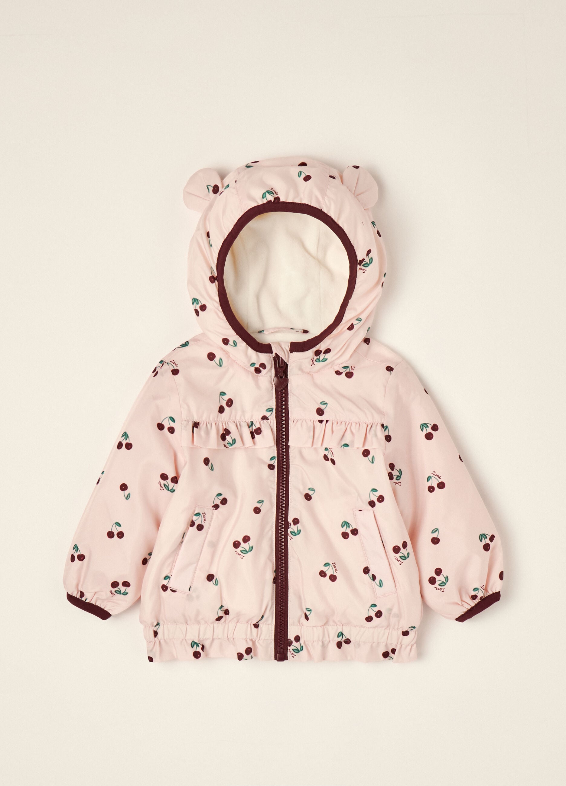 Pink padded hooded jacket with cherry print