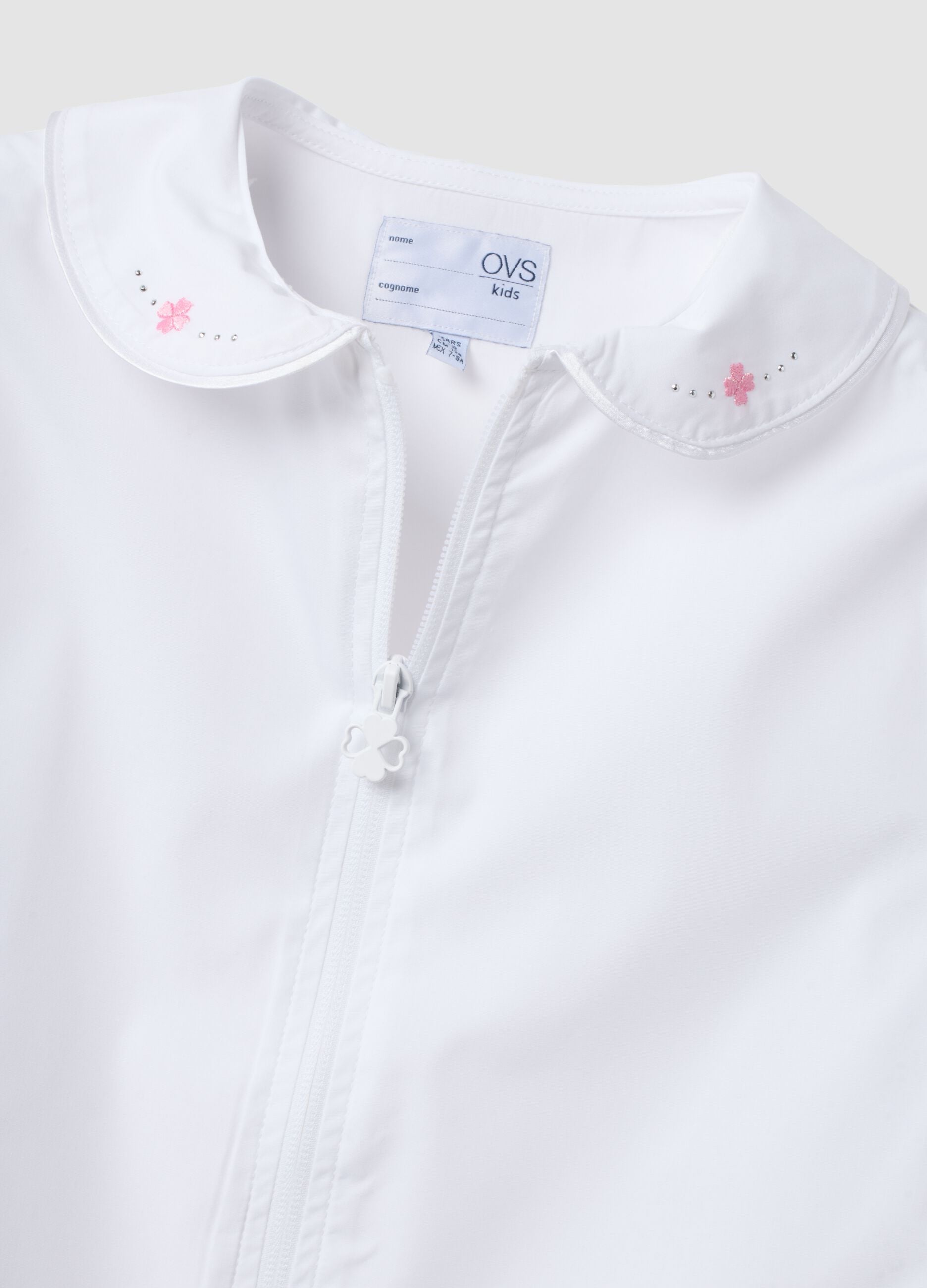 Girls&rsquo; white school apron with zip fastening and classic collar