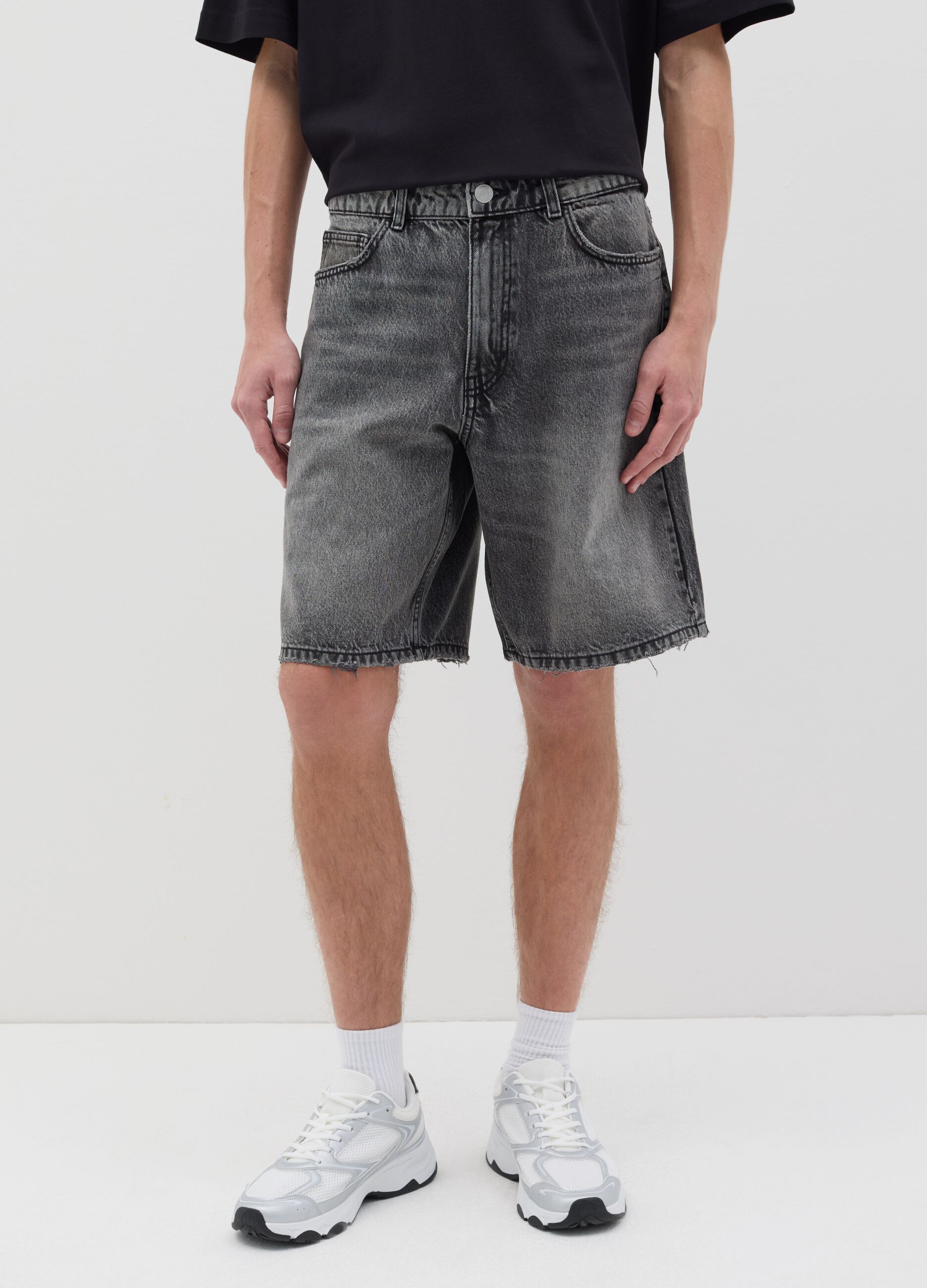 Black denim shorts with ripped details