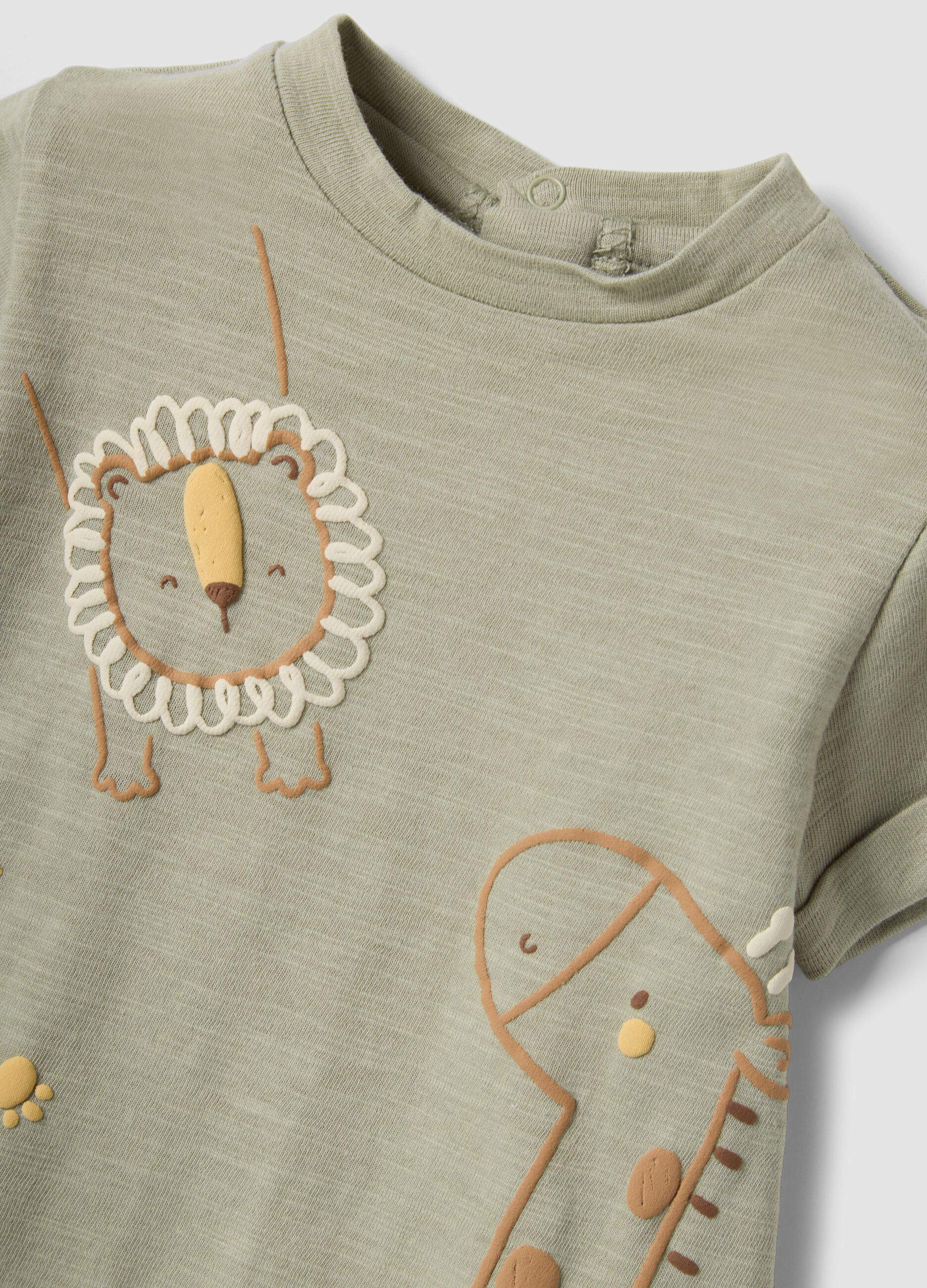 Green organic cotton baby romper with animal print