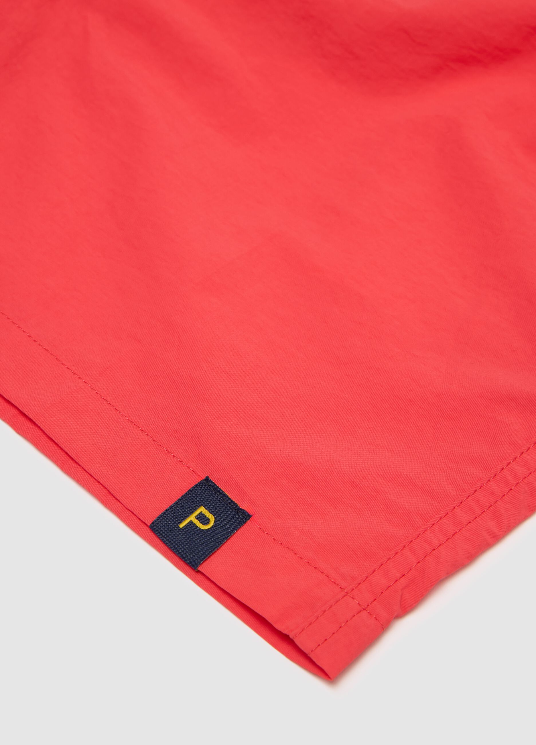 Men’s regular-fit swim boxers in red blend with elastic waist