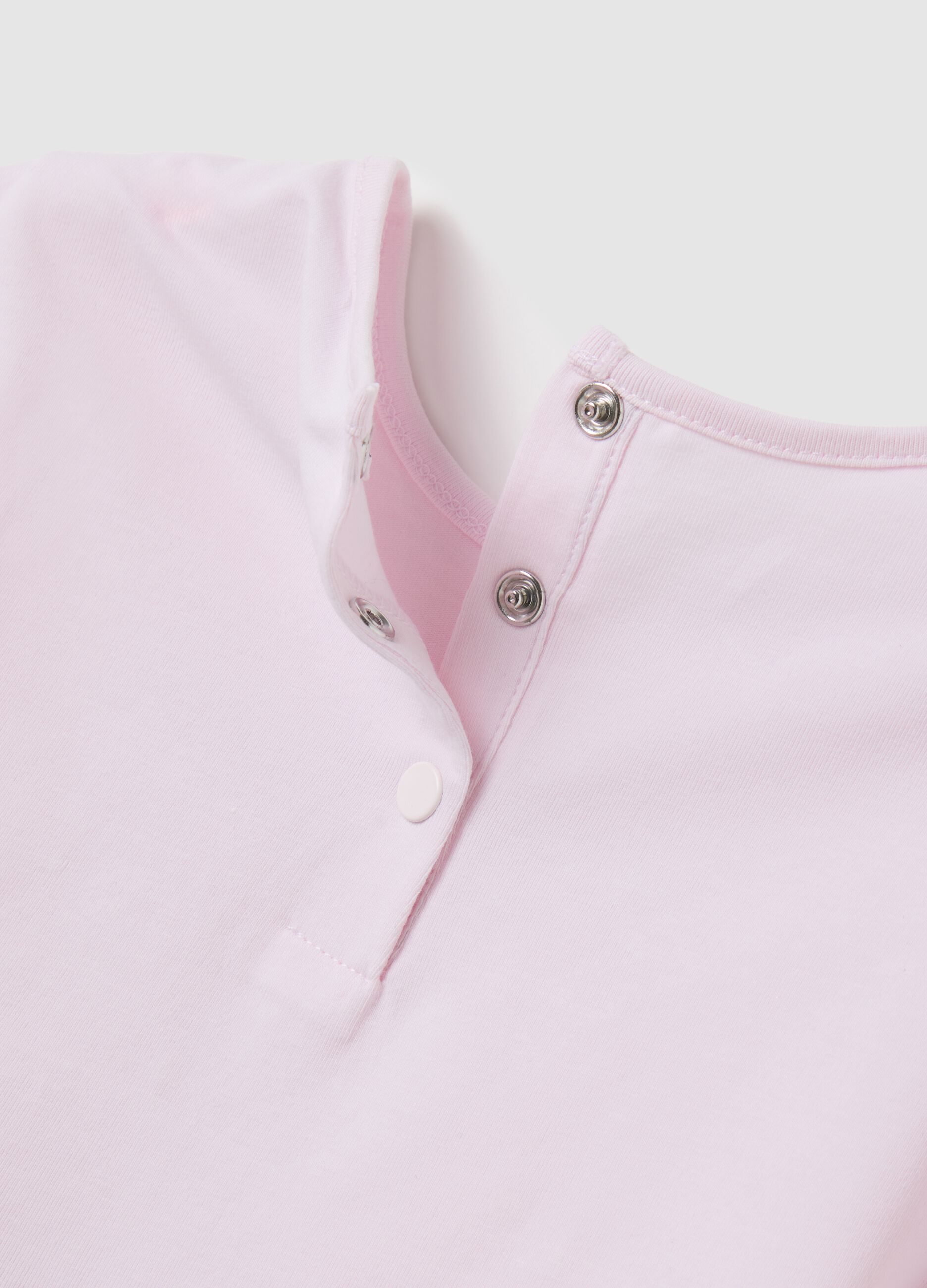 Pink T-shirt with ruffles and floral print