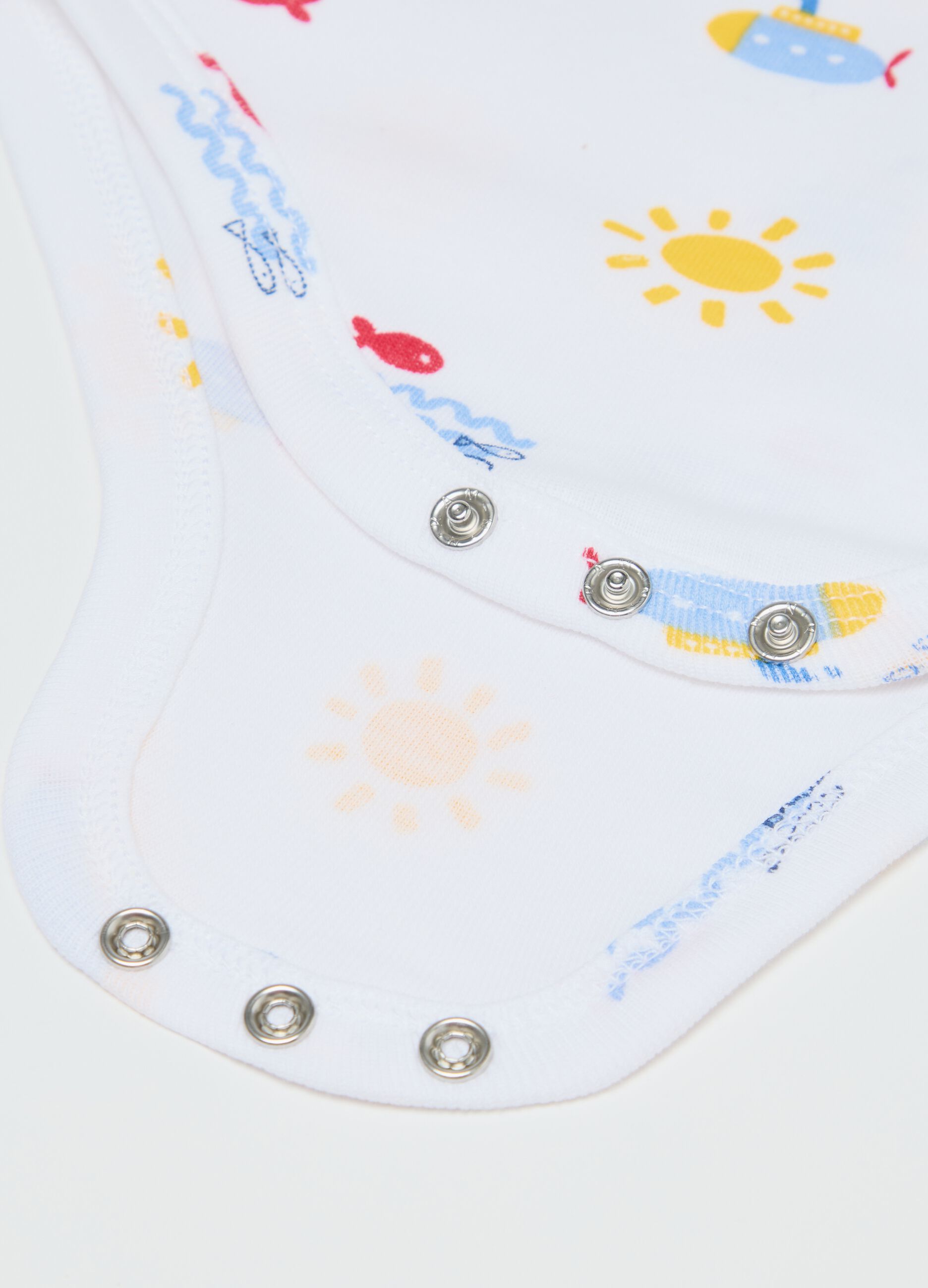 Two-pack white sleeveless bodysuits in organic cotton with print