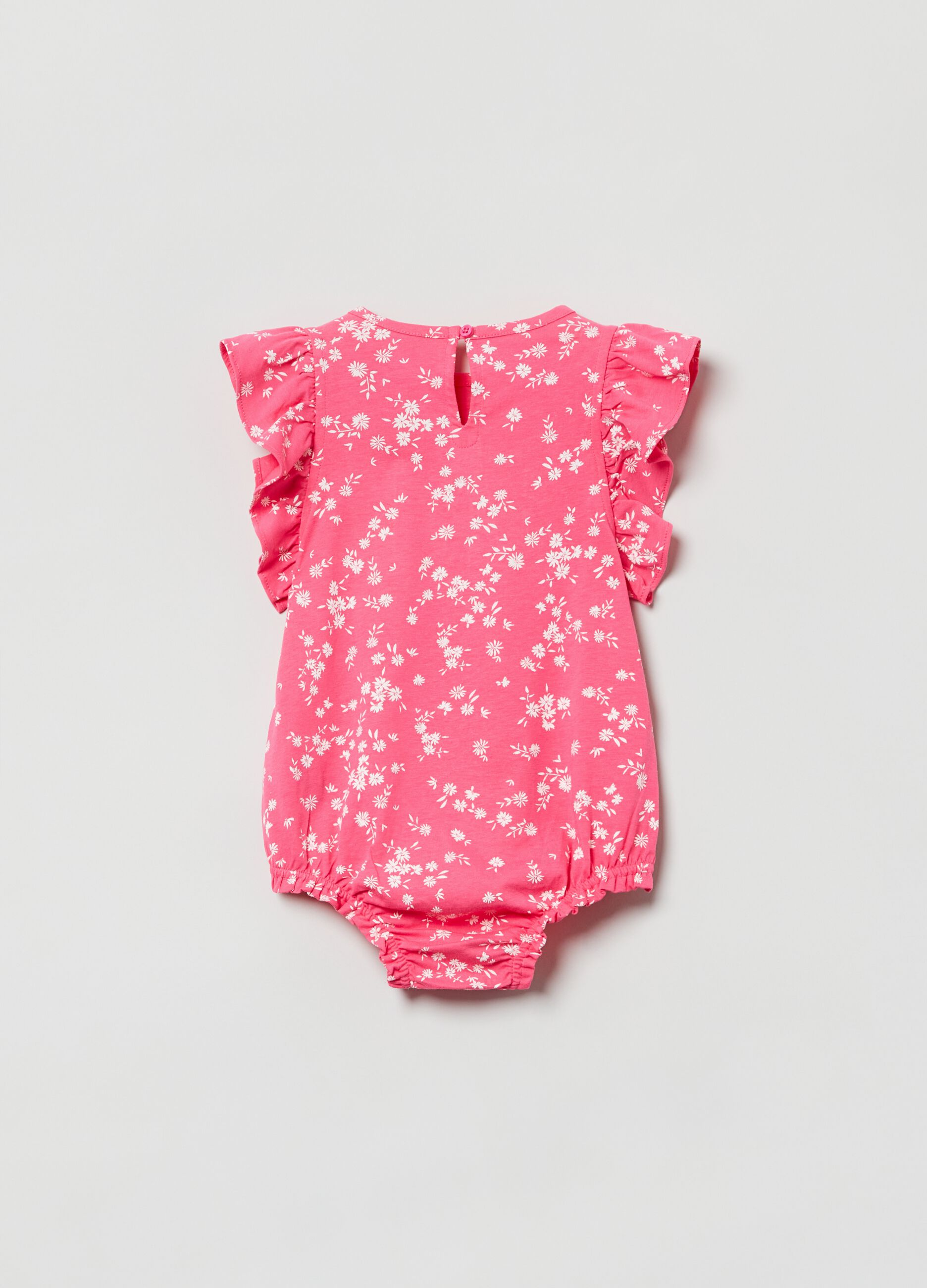 Romper suit with floral print and logo patch