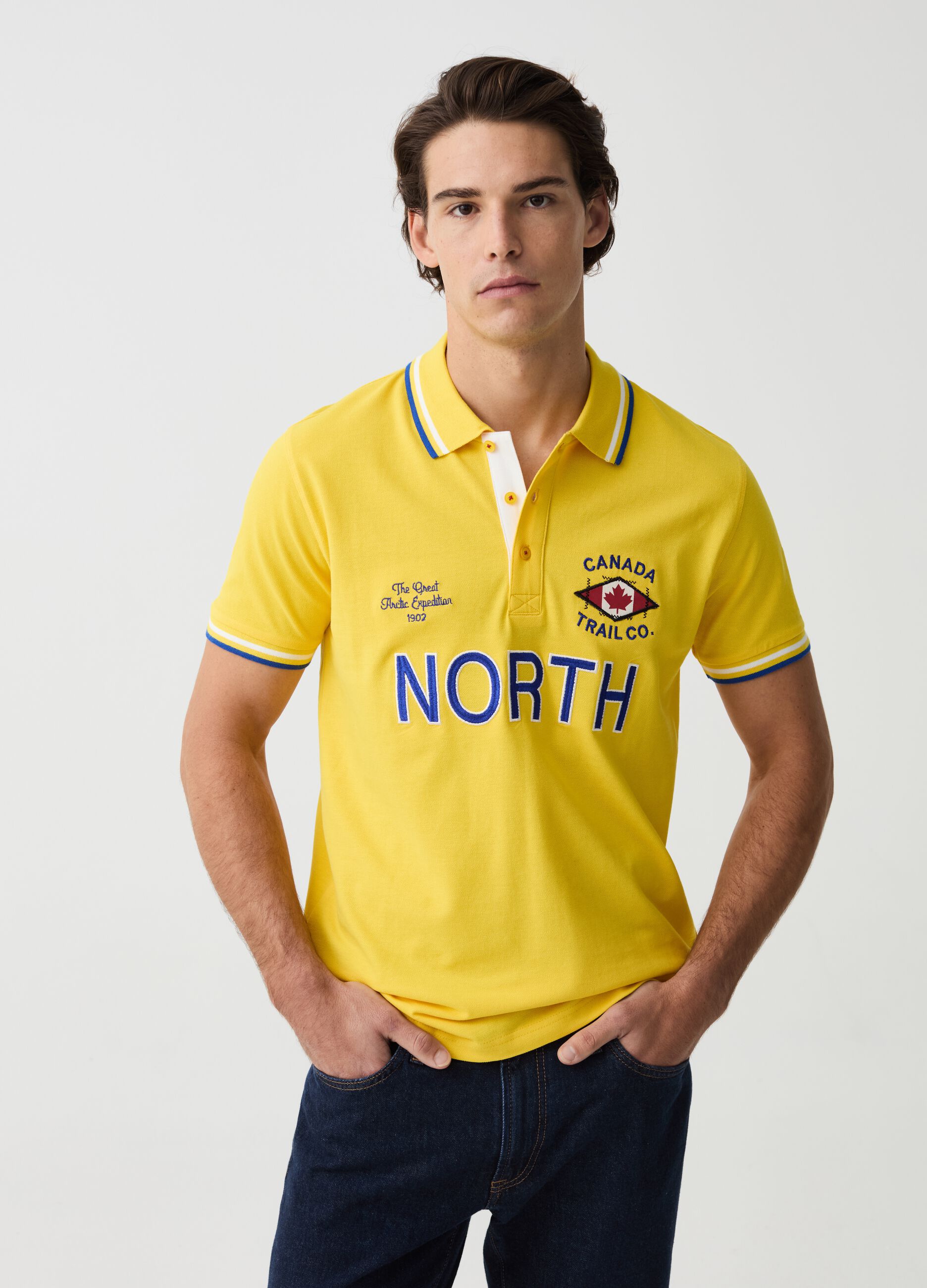 Polo shirt with striped edging and logo embroidery