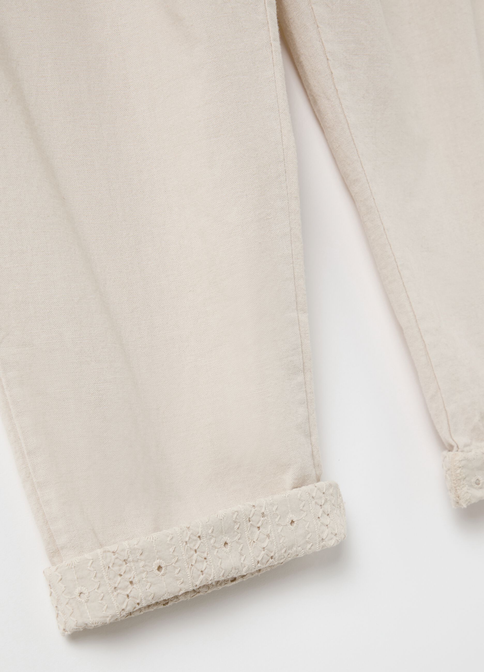 Beige trousers with drawstring and broderie anglaise details