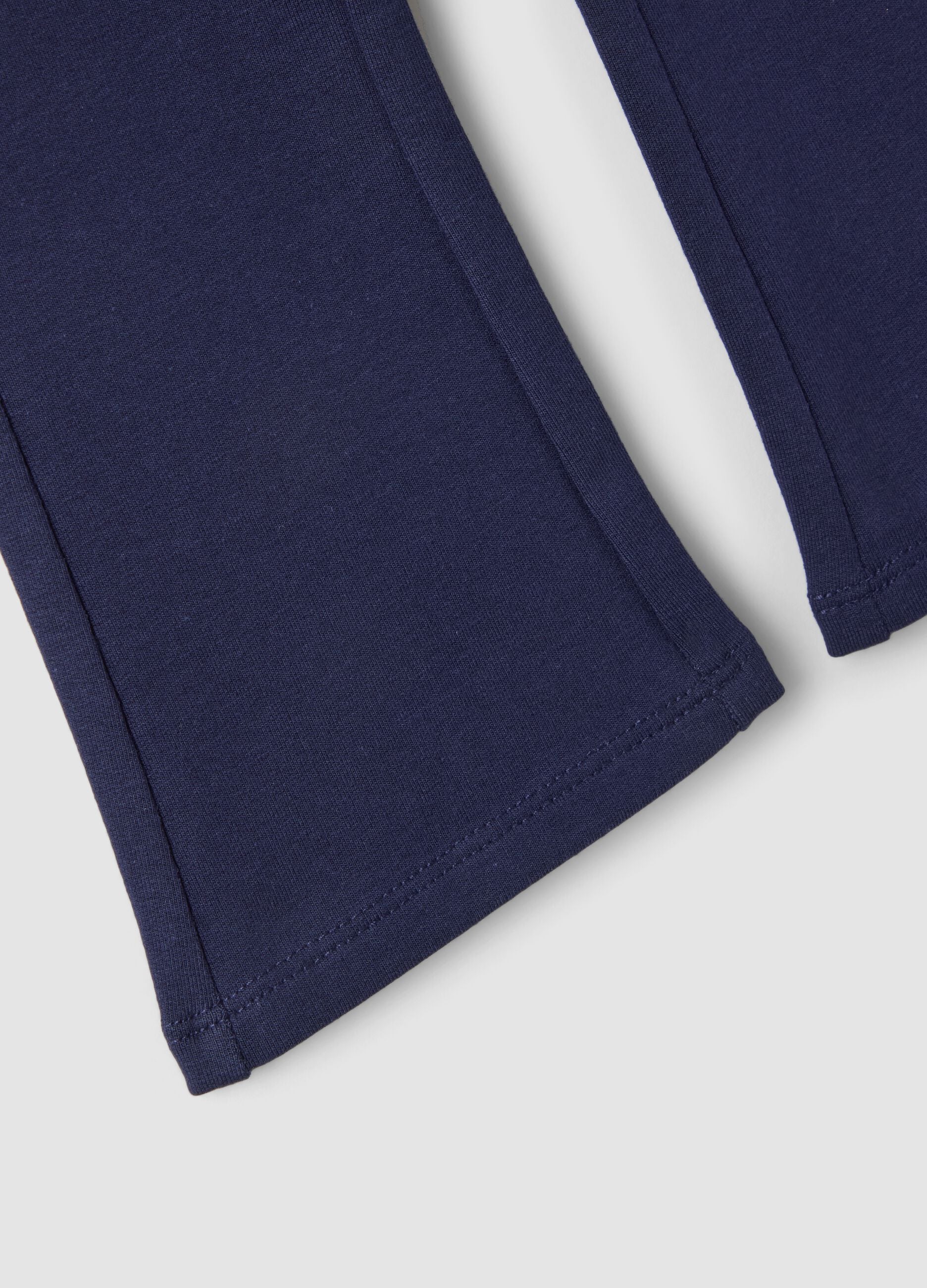 Pantaloni flare blu in cotone organico elasticizzato per bimba