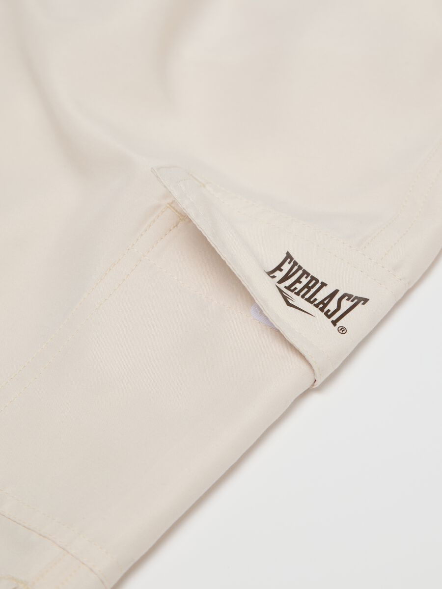 Beige swimming trunks with logo print_5