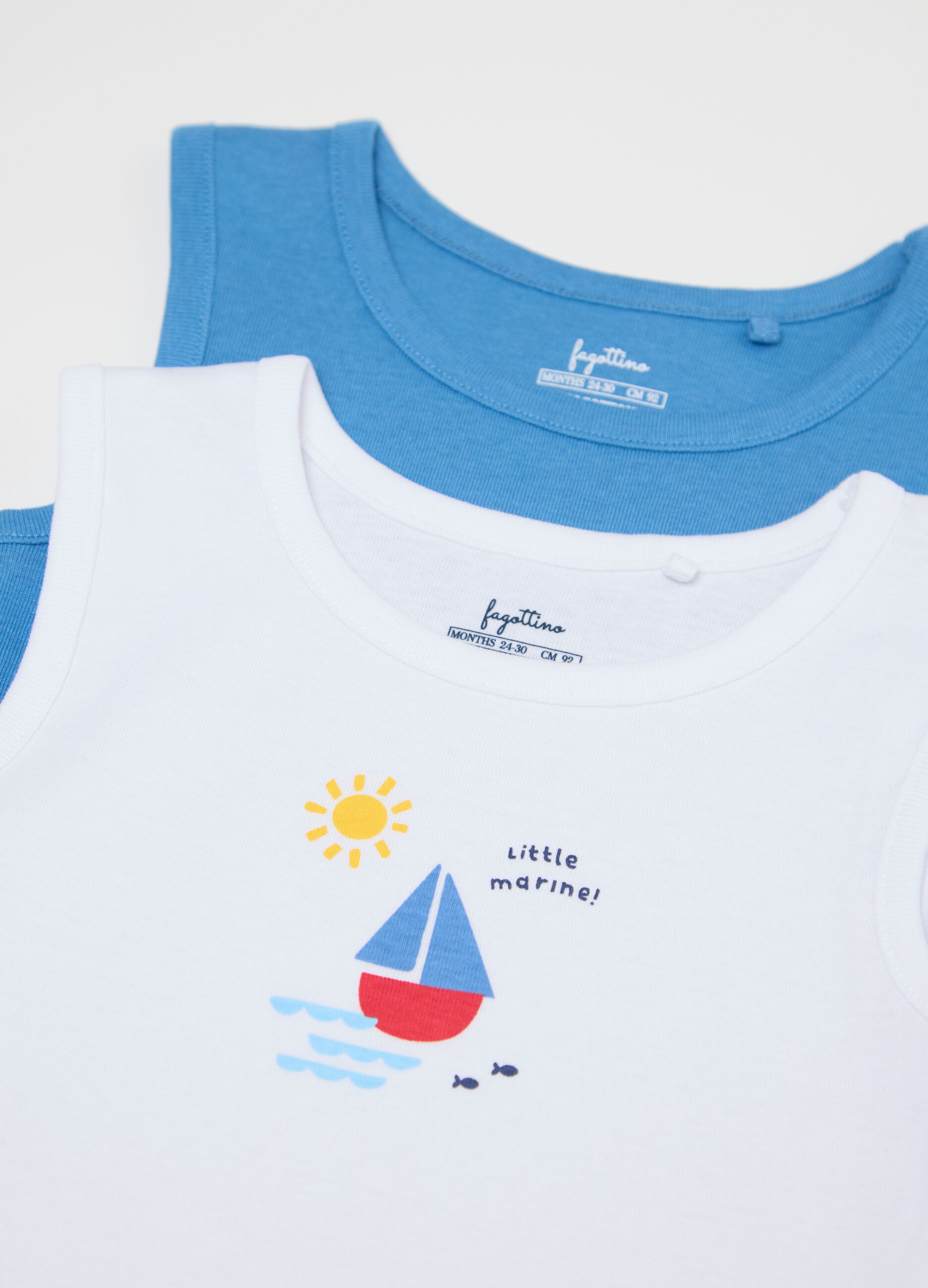 Three-pack white and light blue bodysuits in organic cotton with print
