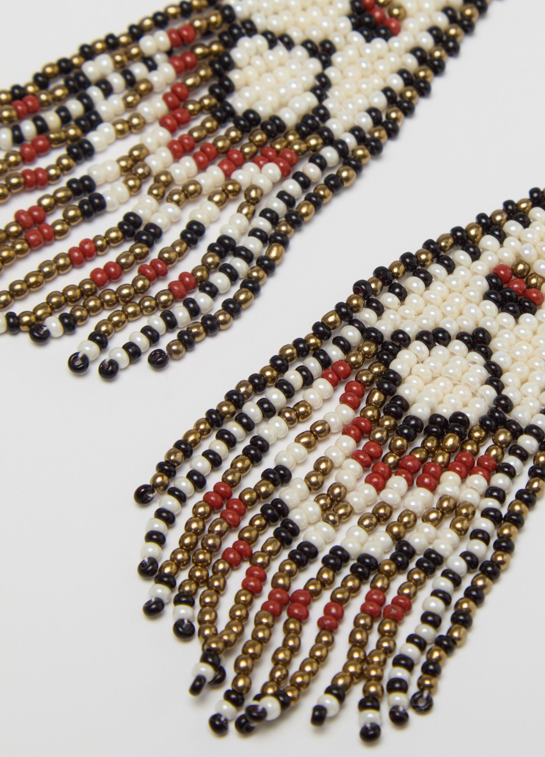 Pendant earrings with ethnic motif