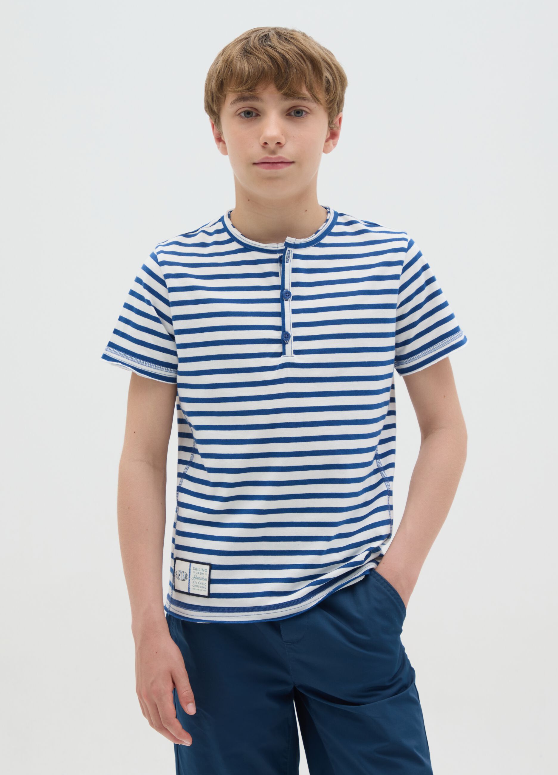 Boy's 100% cotton polo shirt in blue and white stripes with classic collar and regular fit