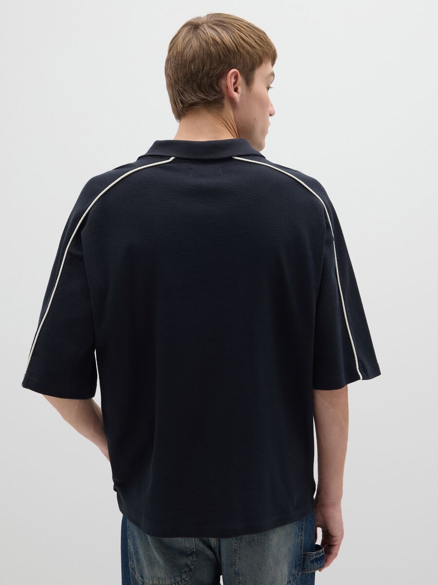 Polo sportiva in puro cotone nero vestibilità oversize_2