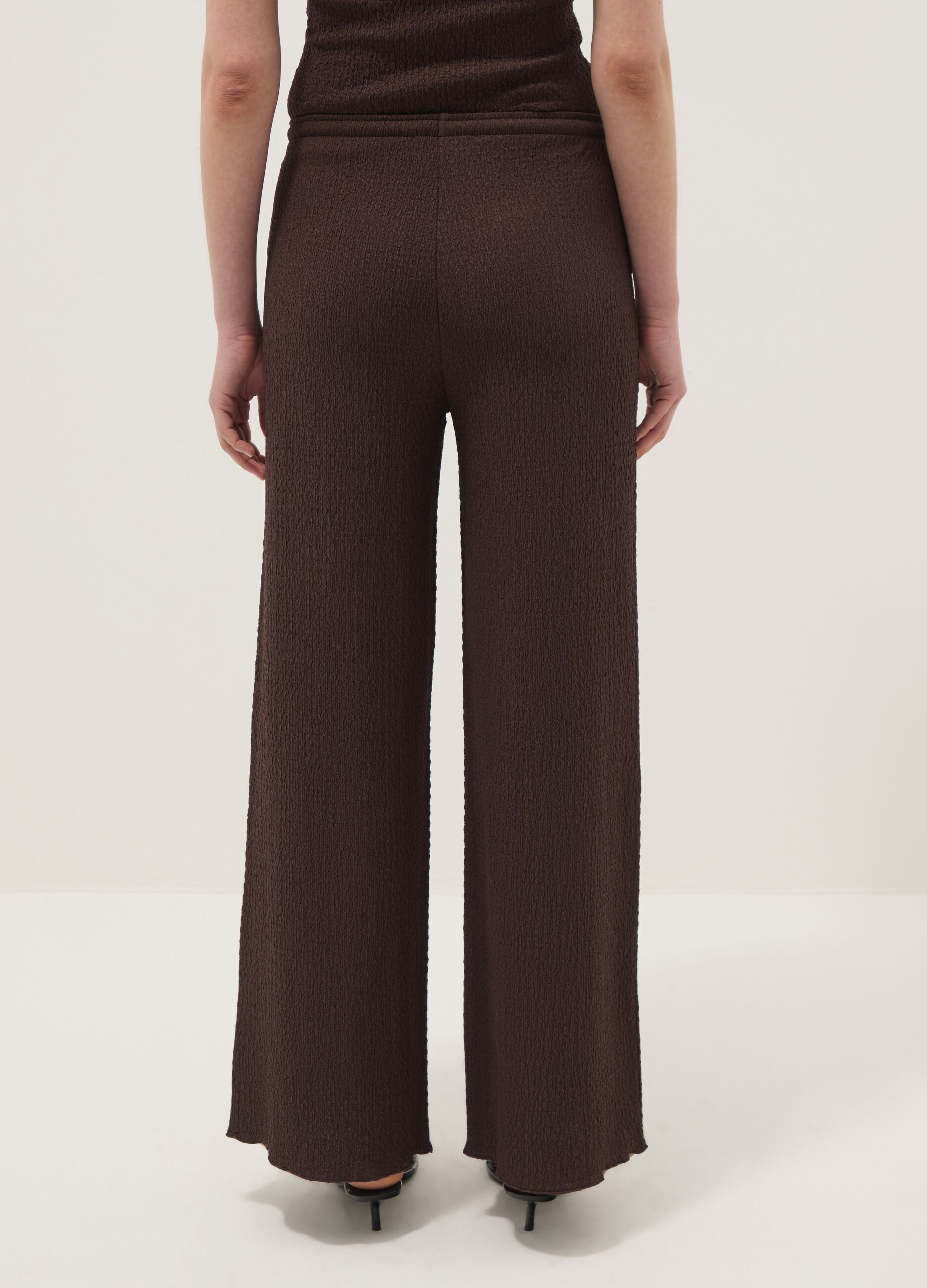 Brown stretch wide-leg trousers with crinkled texture