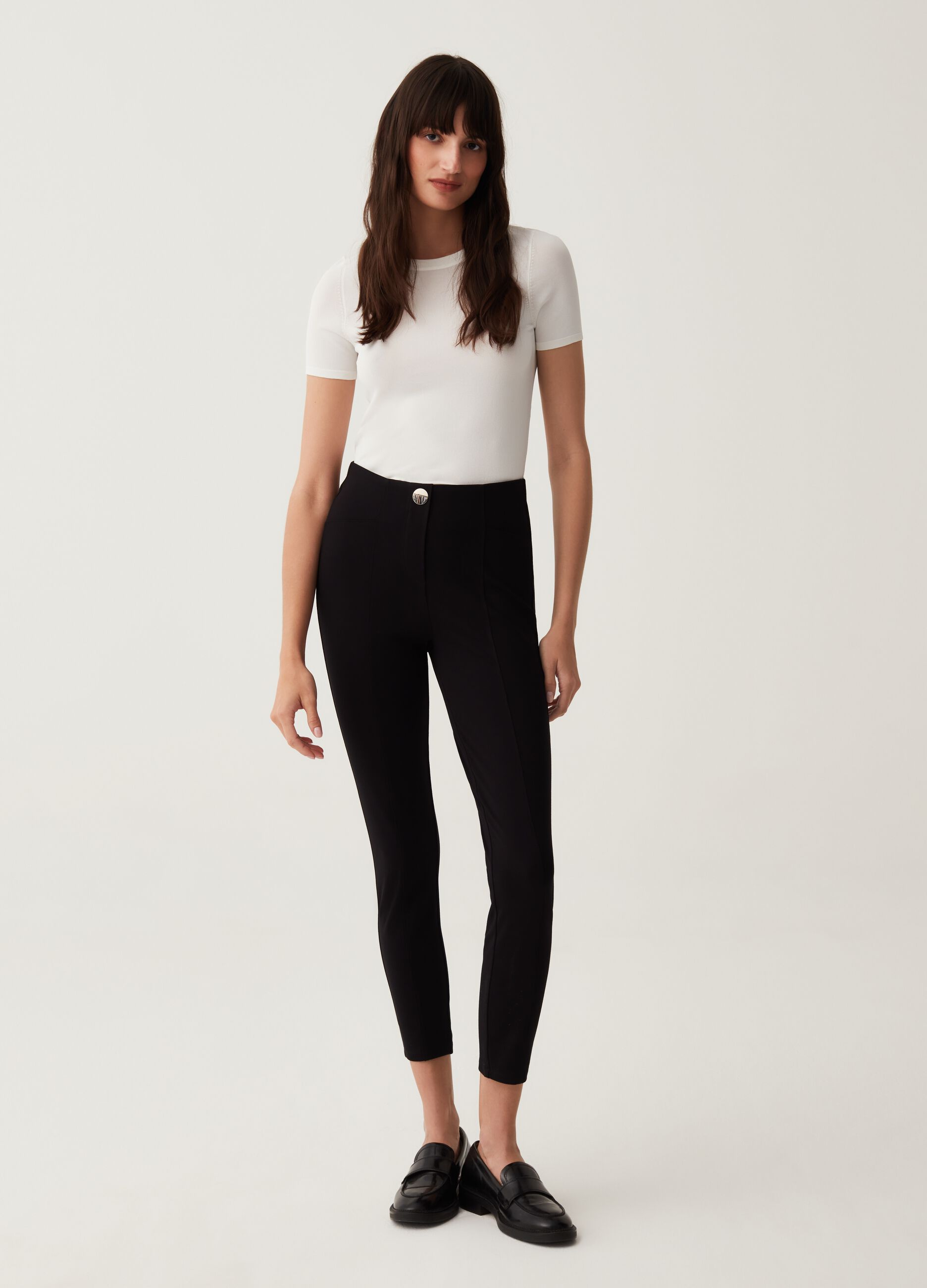 Leggings stretch con bottone