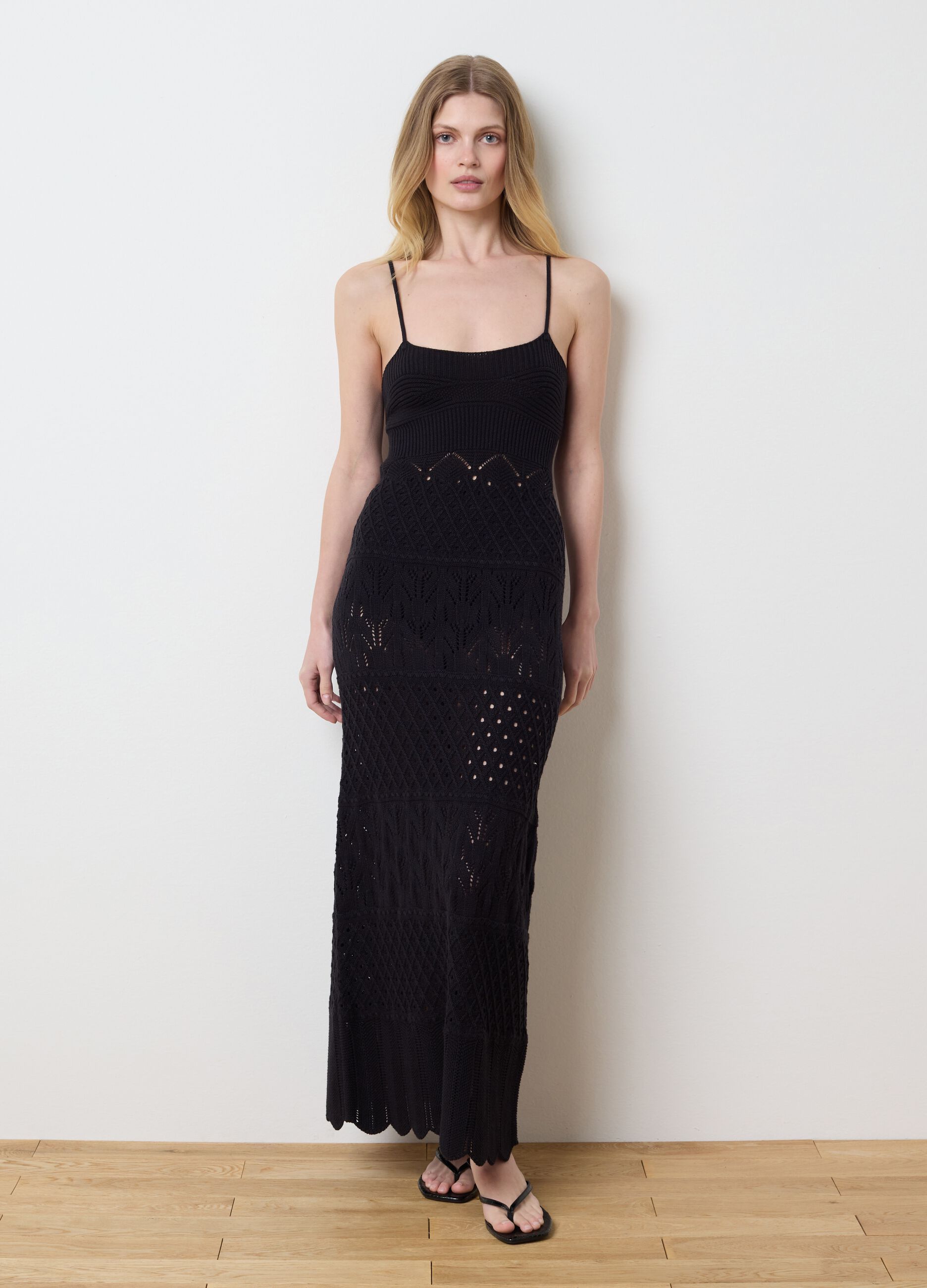 Long black dress in crochet knit