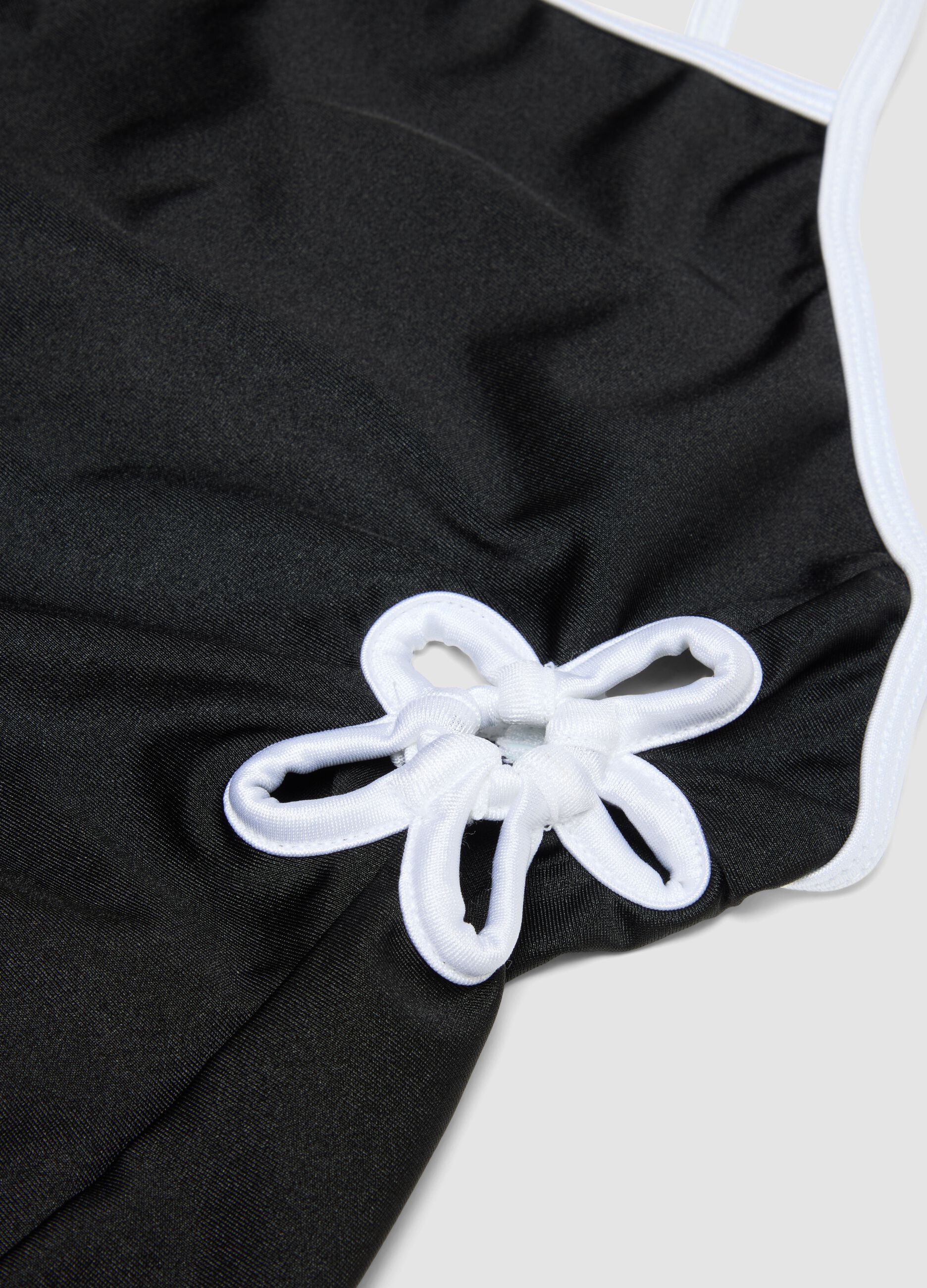 Black stretch one-piece swimsuit with contrasting trim