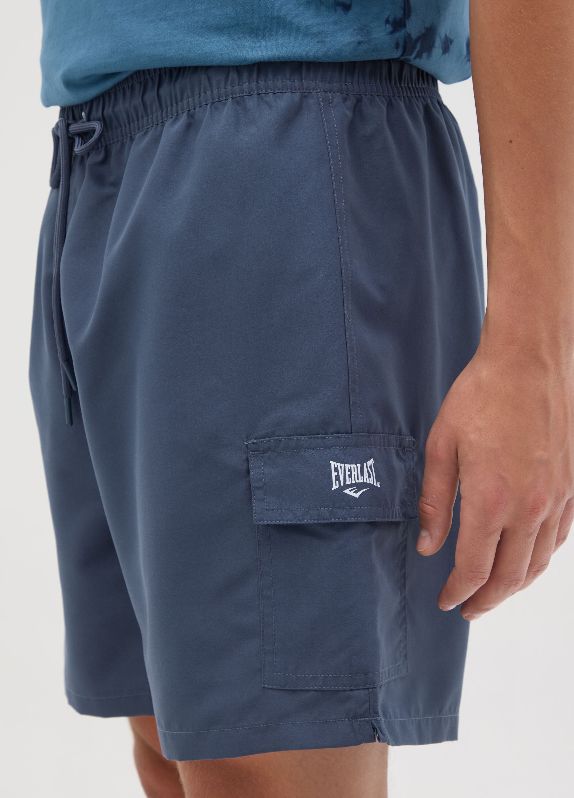 Blue swimming trunks with logo print