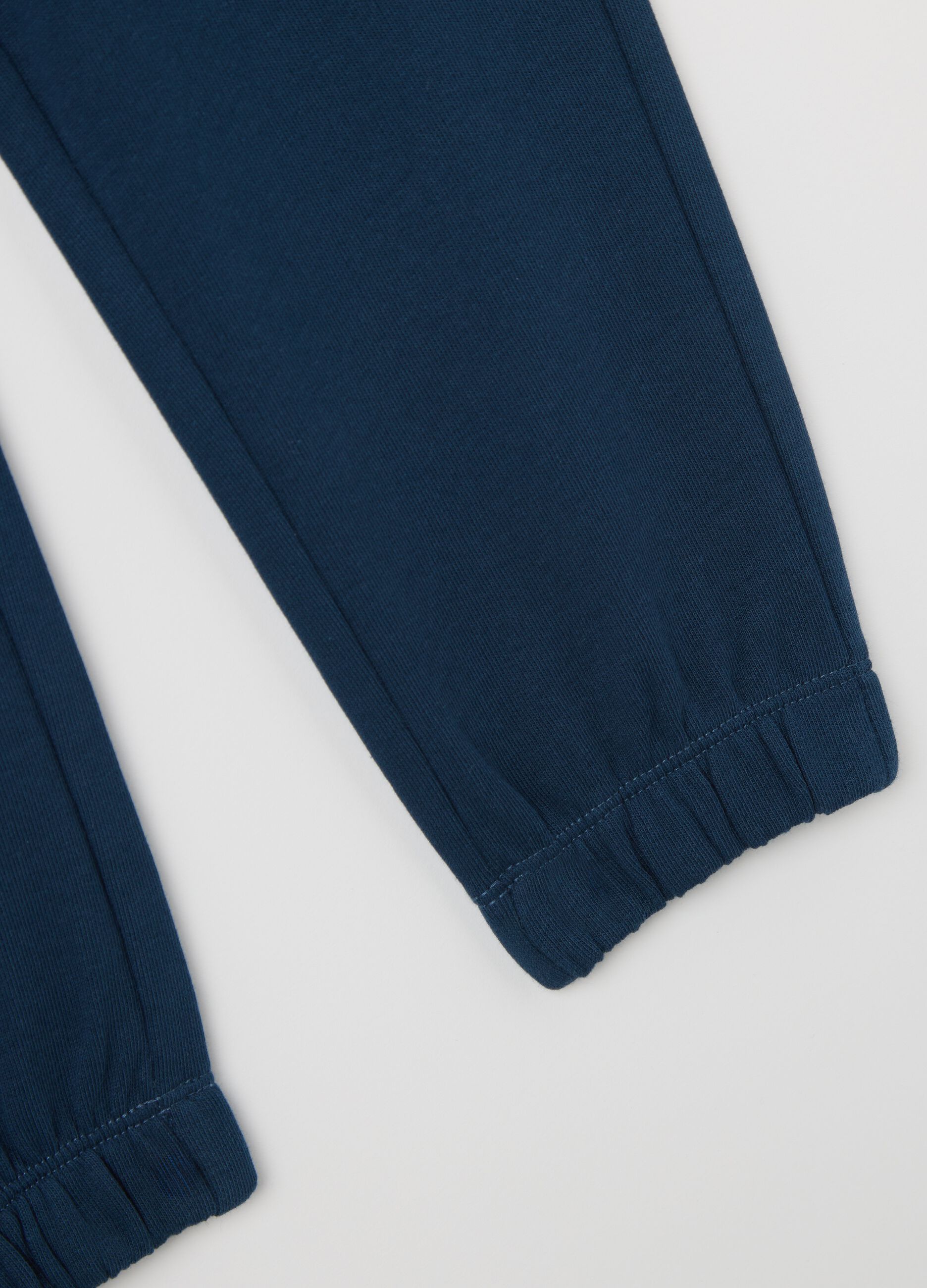 Blue cotton joggers with drawstring and print