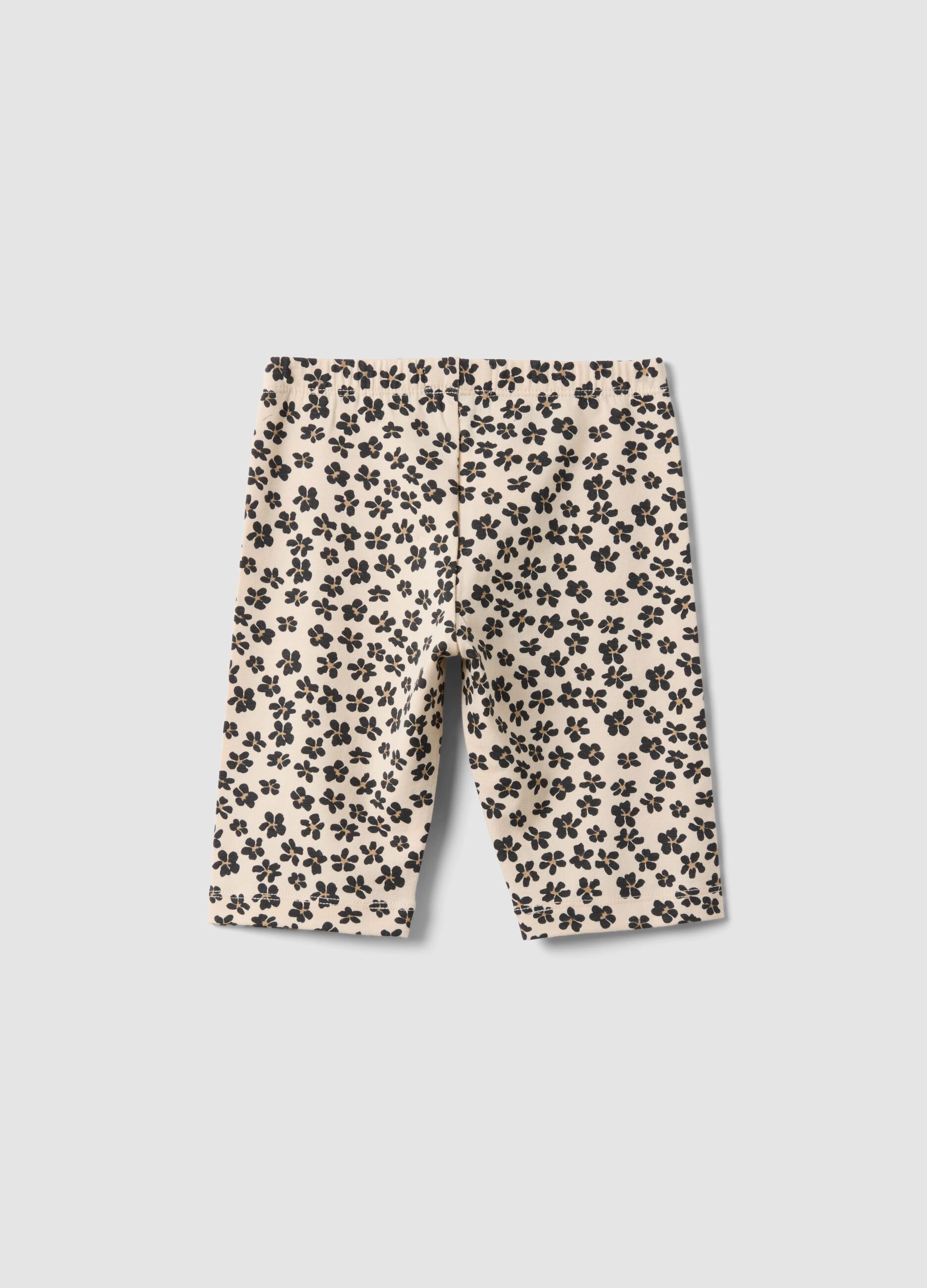 Beige organic cotton shorts with floral print